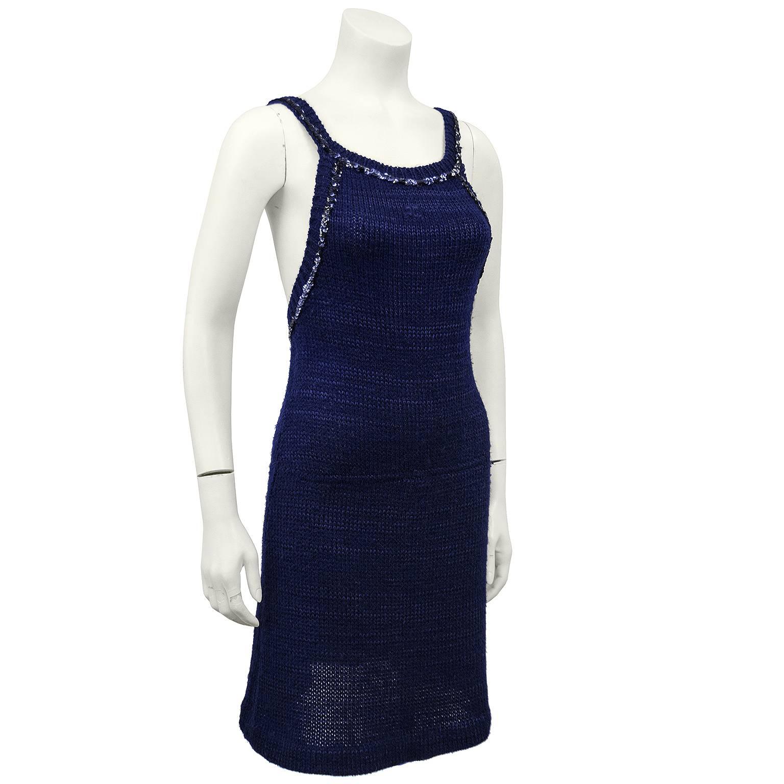 Amazing 1970s Courreges navy blue acrylic and wool knit halter dress. A touch of sparkle with navy blue sequin trim around the neckline, straps and back. Straps are attached with buttons and can be worn straight with and open back or crossed. Small