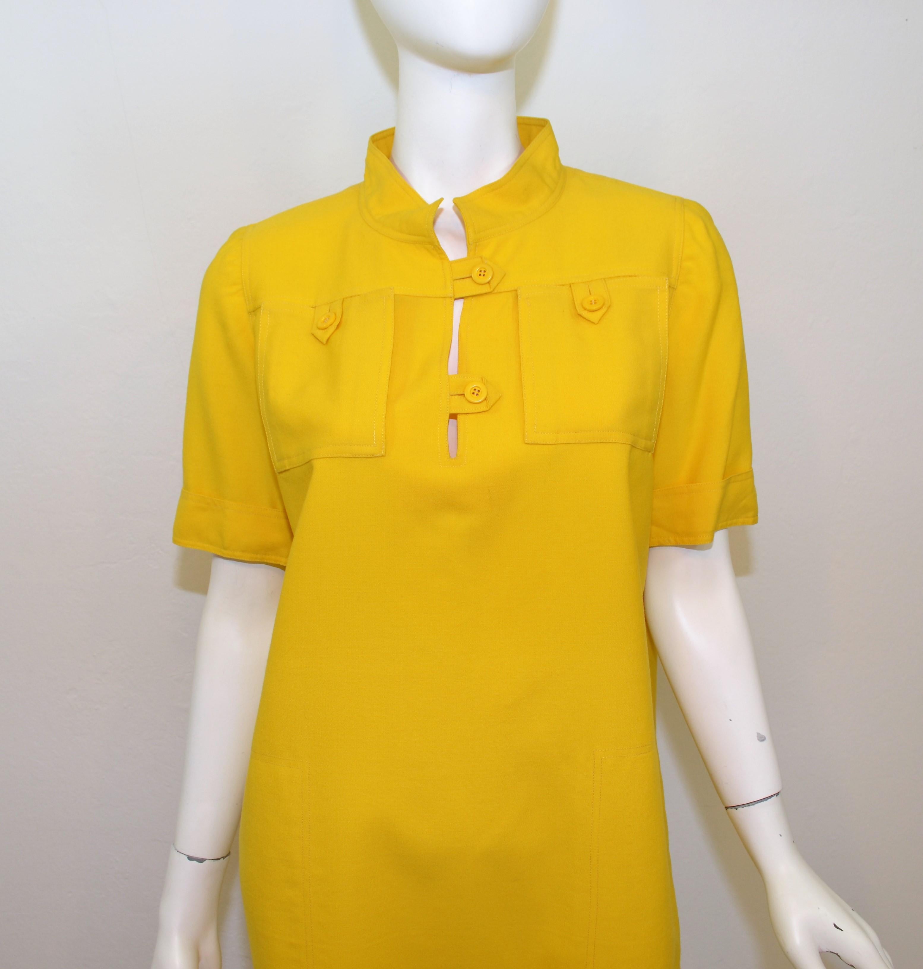 1970's Courreges Vintage Yellow Dress features buttoned pockets at the bust and button closures at the neck, vintage size B, made in France. 

Measurements:
Bust 42''
Waist 44''
Hips 46''
Length 37''