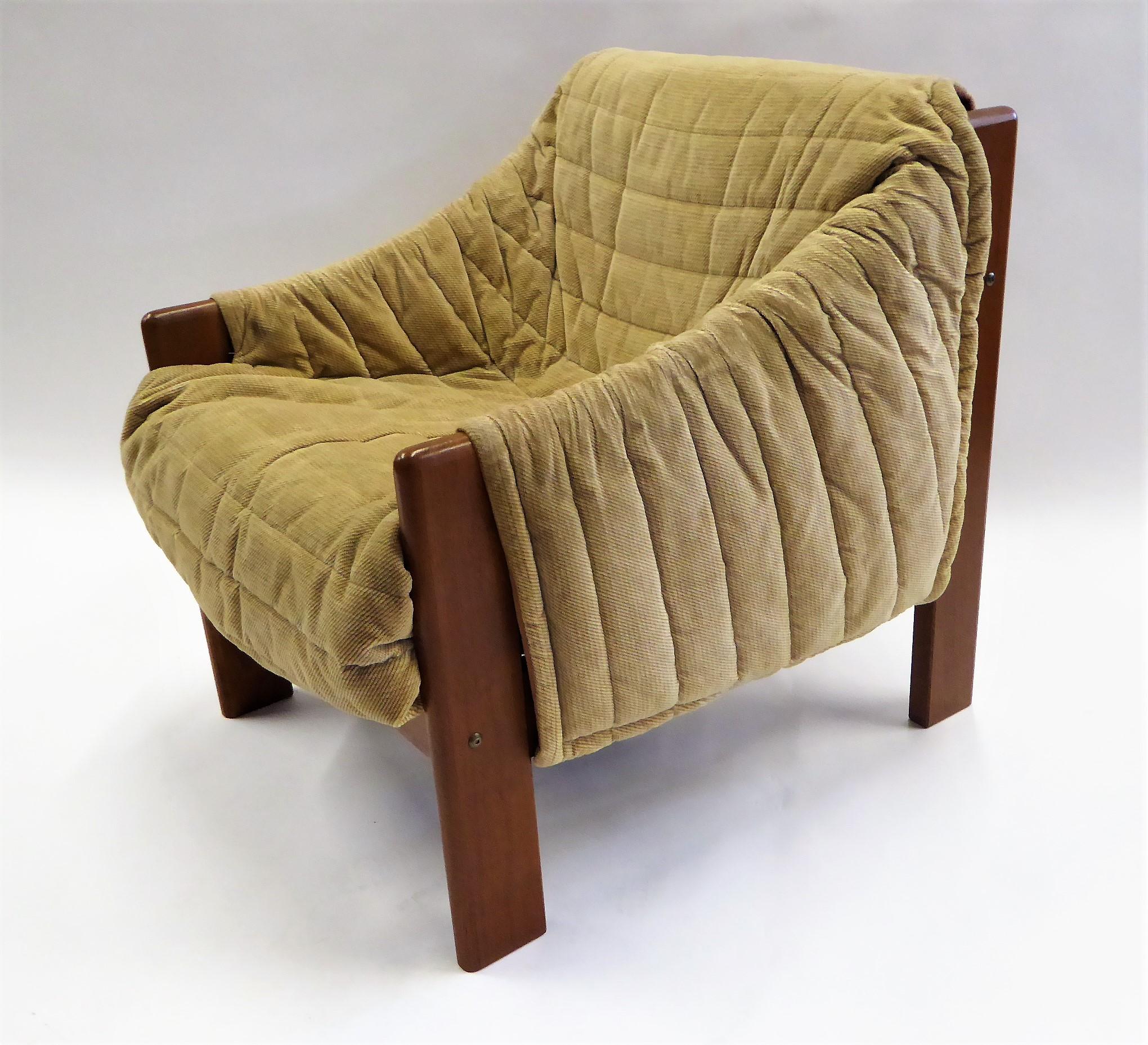 Solid teak and a quilted Chenille wrap cover highlight this armchair from Domino Møbler. A cozy 1970s Lounge chair from Denmark, plush and comfortable. Solid teak framing. Domino Møbler.
Measurements: 30 inches deep x 25 inches wide x 29 inch high