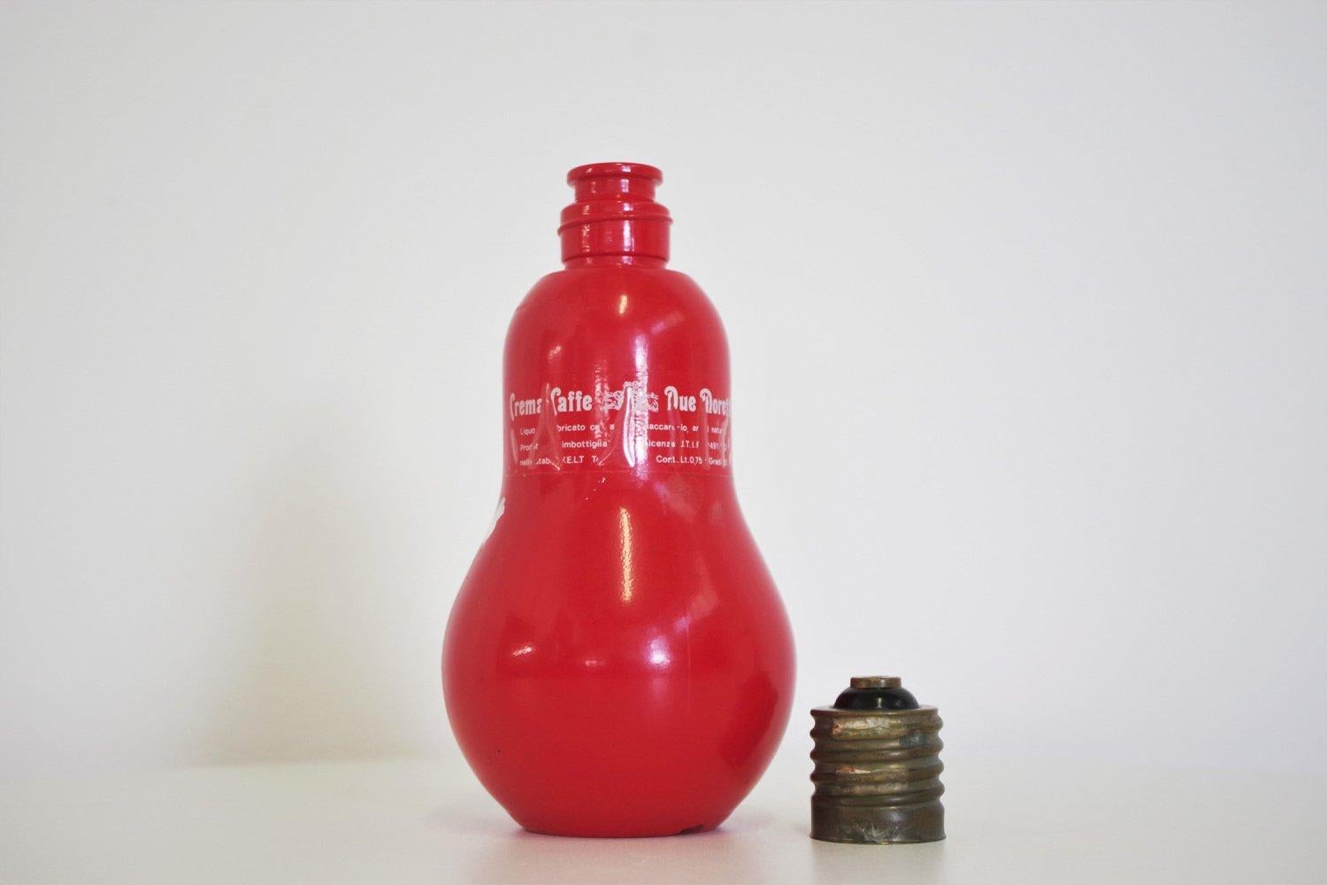 1970s Cremacaffè Due Moretti Lightbulb-Shaped Bottle - Quirky Italian Design

This vintage 1970s Cremacaffè Due Moretti bottle, designed in the playful shape of a lightbulb, is a unique and charming piece of Italian design. Perfect for collectors or