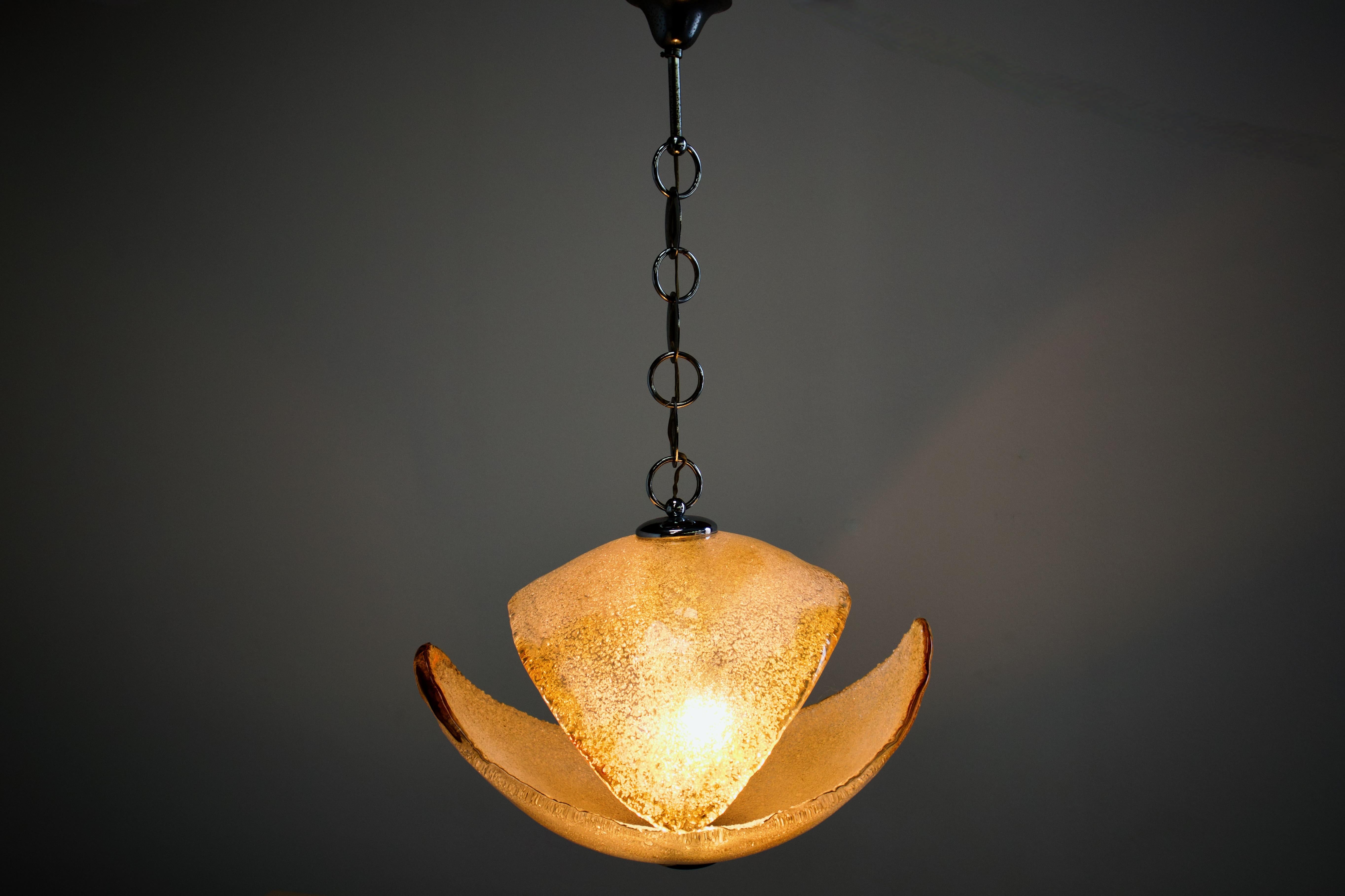 Large unique 1970s Italian Mid-Century Organic Modern double crescent pendant lamp. Two large and very thick hand blown Murano glass crescents are bisected by a metal column. 

The crescents are clear glass dappled with transparent yellow. They are