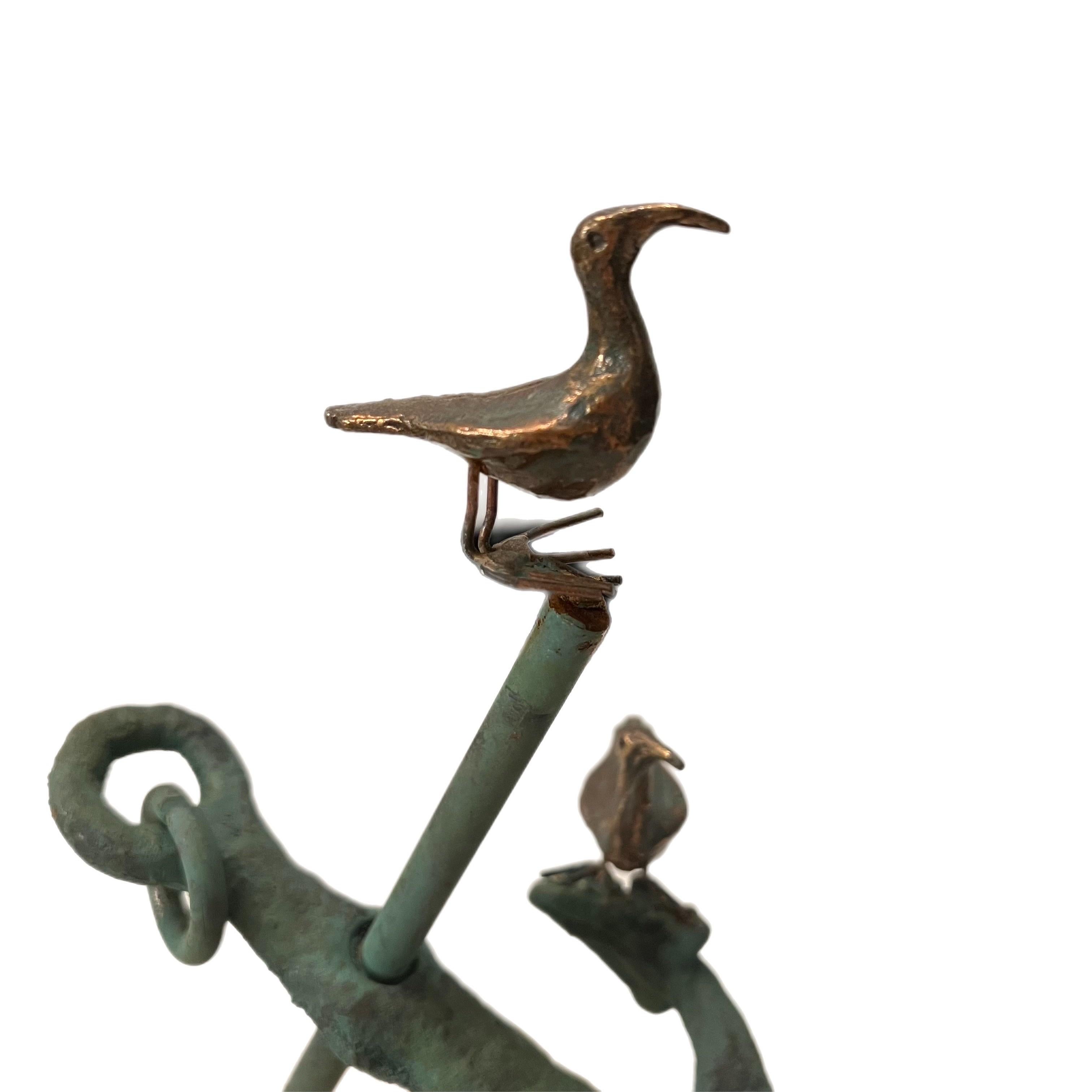 Mixed metals make this coastal mid-Century sculpture of an anchor with 2 sea birds perched atop.  The anchor comes off and can be repositioned to your liking.   The base of the sculpture is made of pink marble, unpolished   Signed “C. Jere 1971” on
