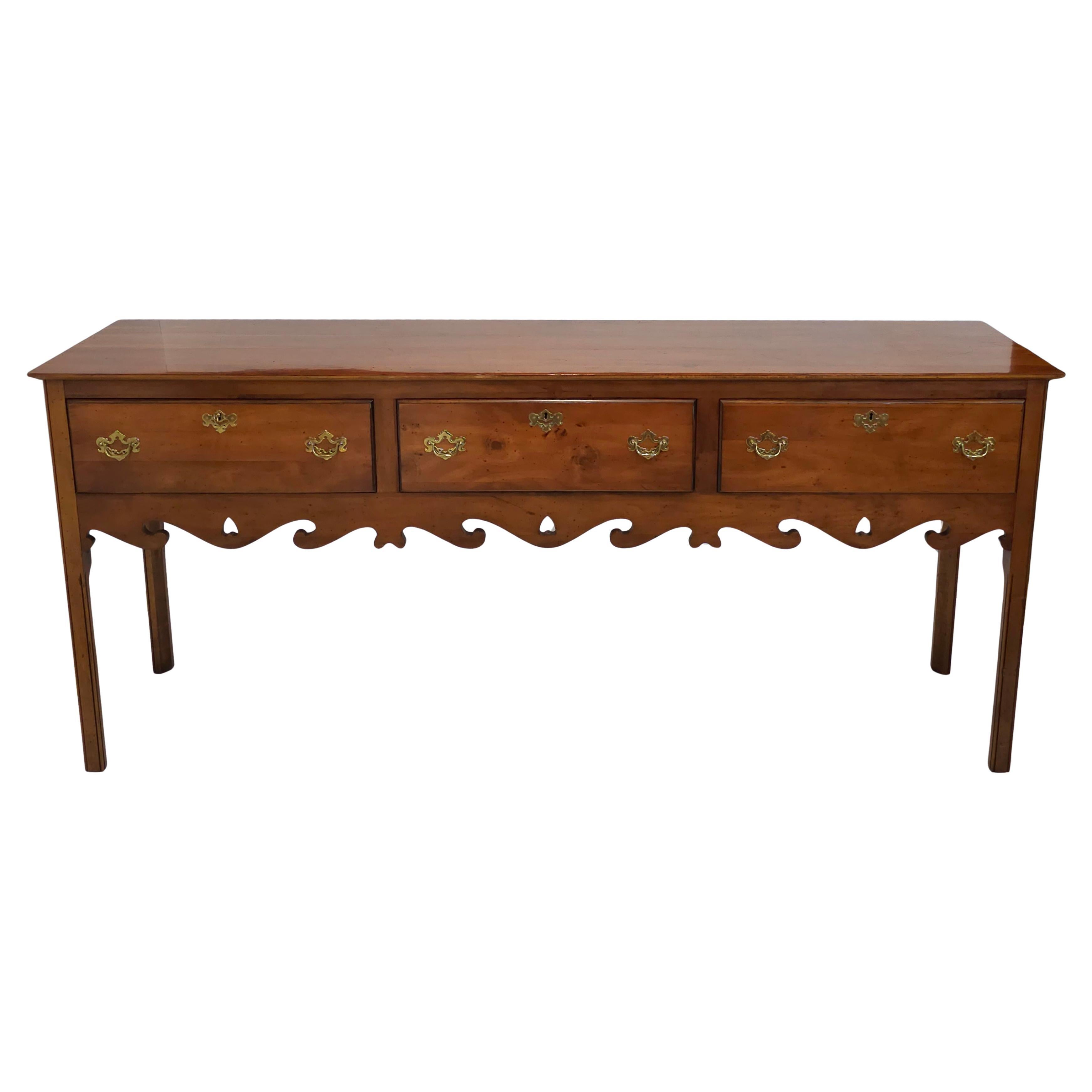A 1978 Custom Made Wright Table Company's Chippendale Solid Yew Wood Sideboard. This extra long 80.5
