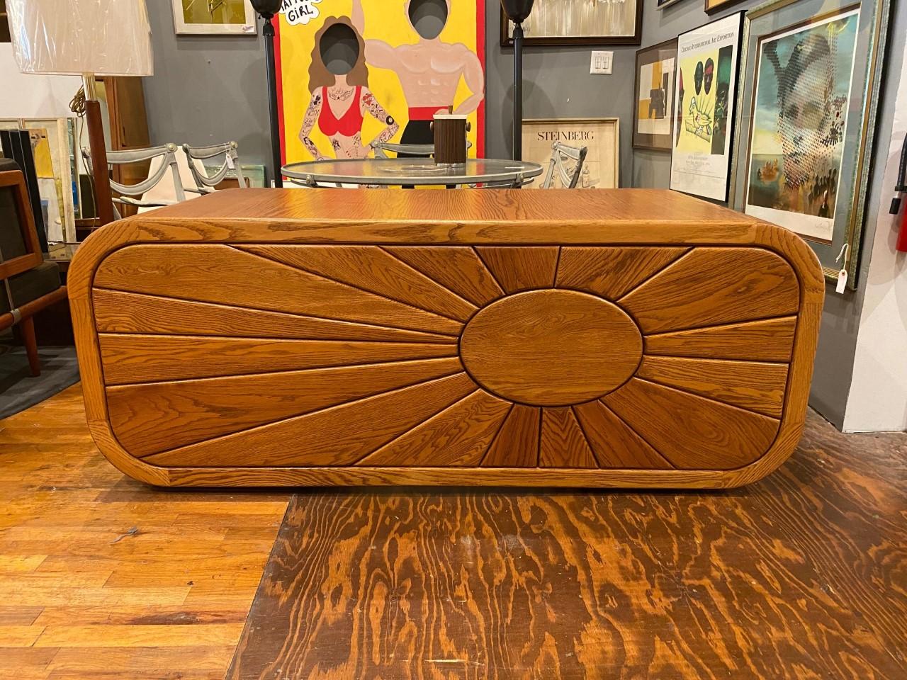 A unique silhouette with generous curves and an impacting yet joyful sculpture on the front, this desk is a one of a kind. This piece dates back to the 1970s and it manifests a design aesthetic that is full of optimism and light. The piece is