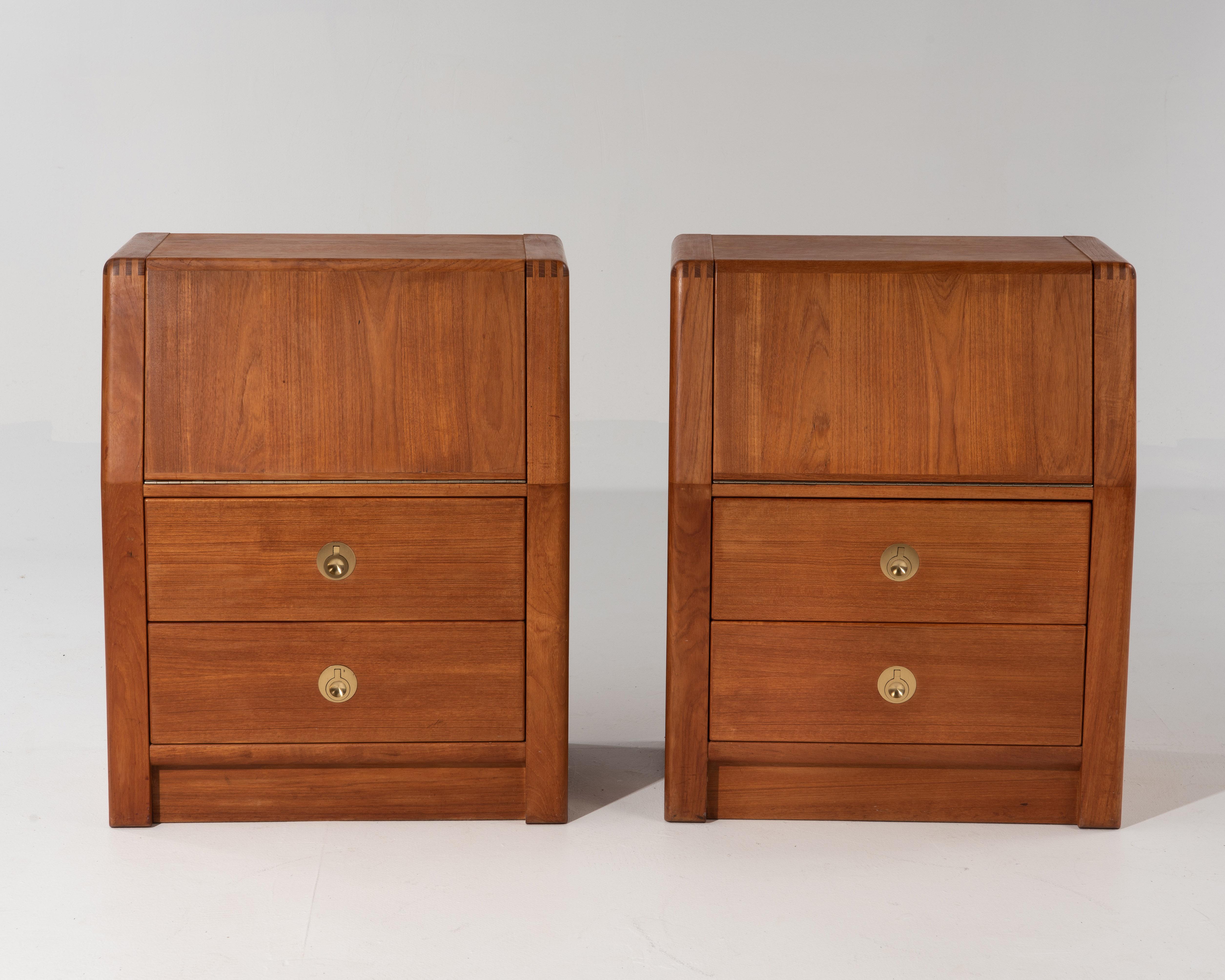 A beautiful and well made pair of Danish teak nightstands made by D-Scan in the 1970s for their 