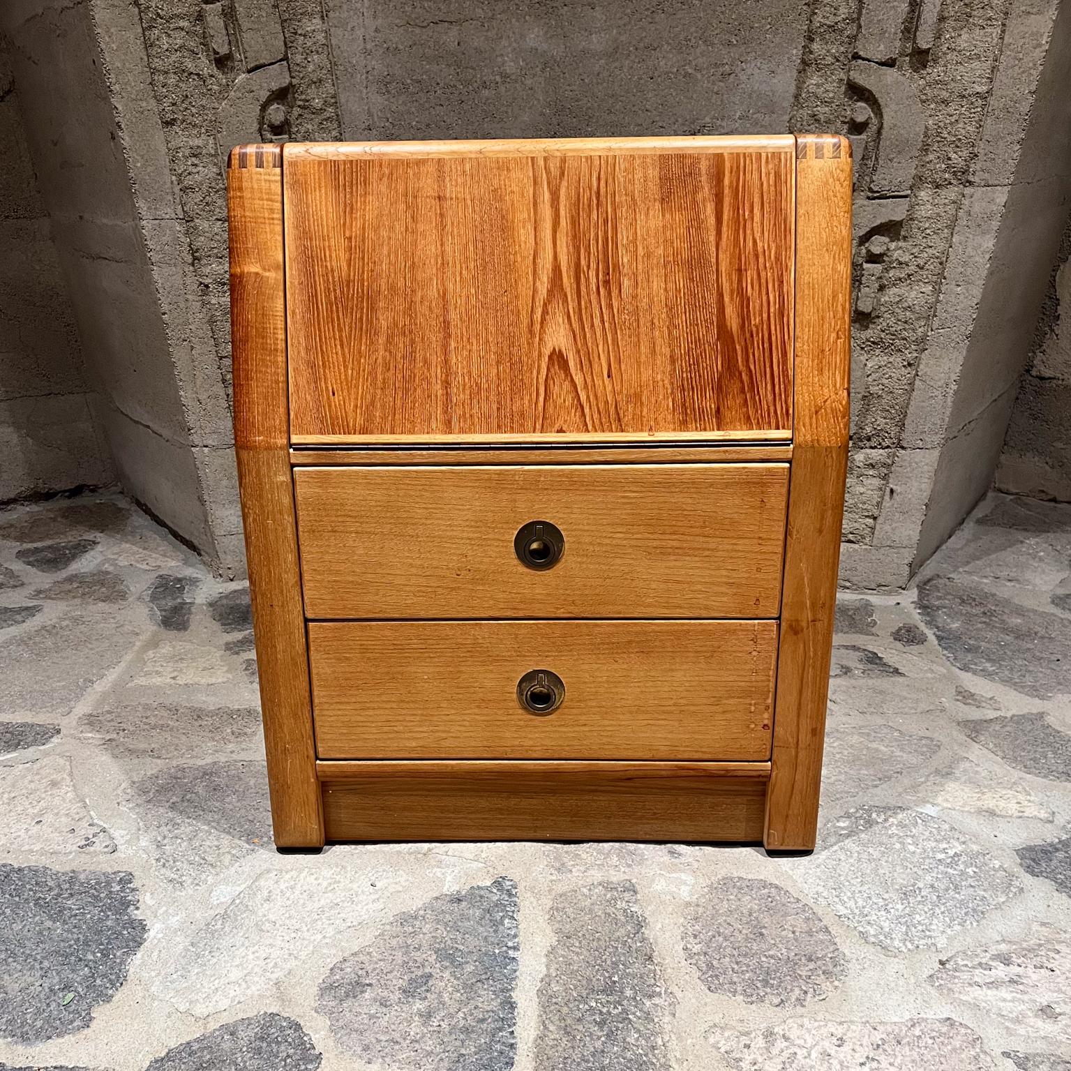 1970s D SCAN Denmark Nightstand Cabinet Bedside Table
maker label present
Teak Wood and Brass
Locking drawer, key included
Draw-bridge door provides ample private storage. 
Exposed joints along the top corners showcase expert craftsmanship.
Stylish