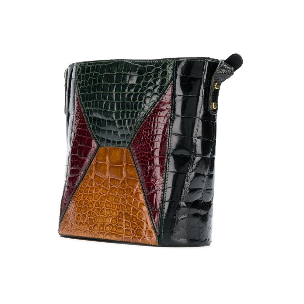 Dal Cò black leather bucket bag with green, black, burgundy and beige crocodile leather. Drawstring closure and golden metal details, adjustable shoulder strap, internal zip pocket.

The bag shows signs of wear and scratches, as shown in the