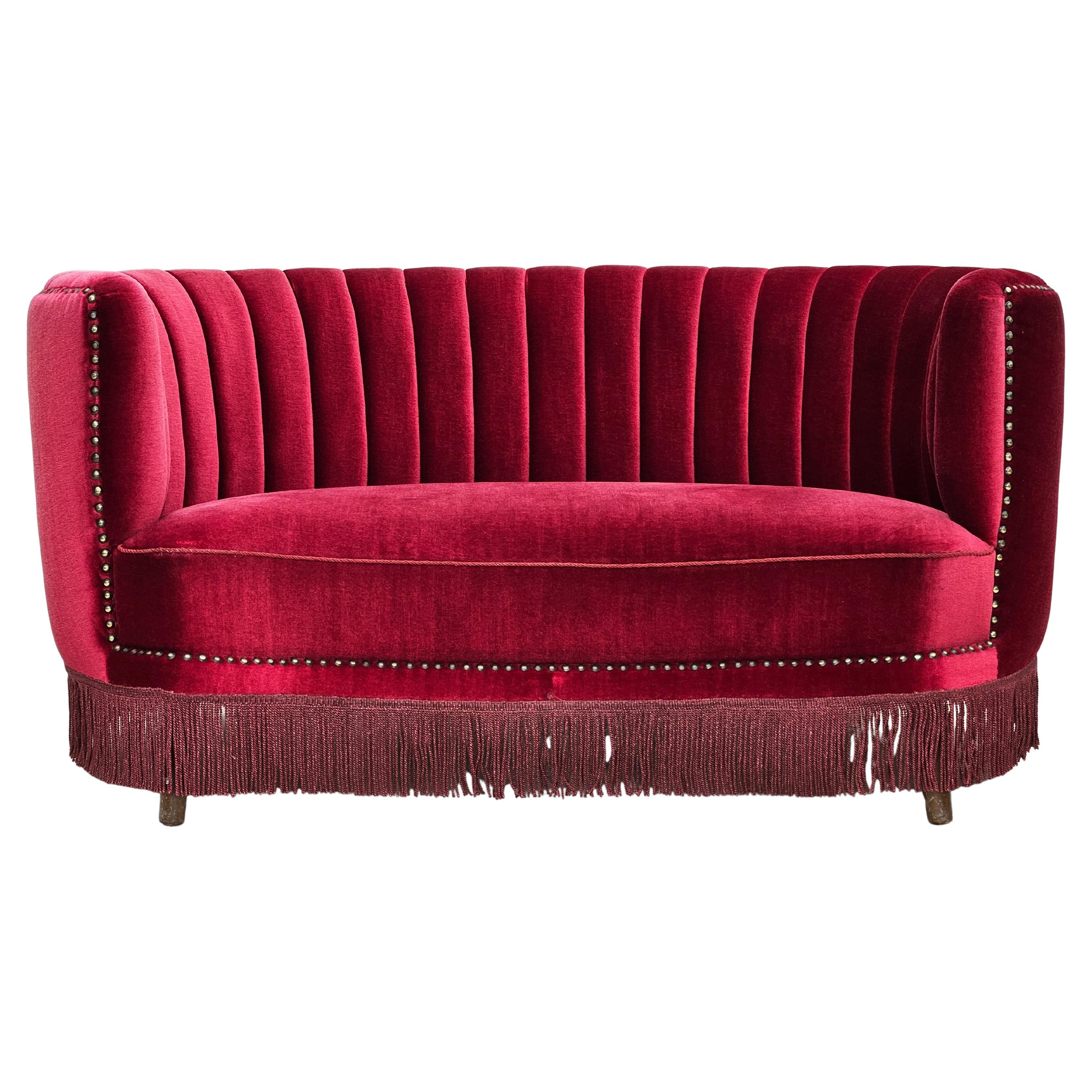 1970s, Danish 2-seater "Banana" sofa, original cherry-red velour.