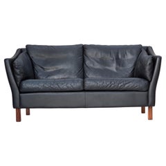 1970s, Danish 2-seater sofa, original black furniture leather, teak wood legs.
