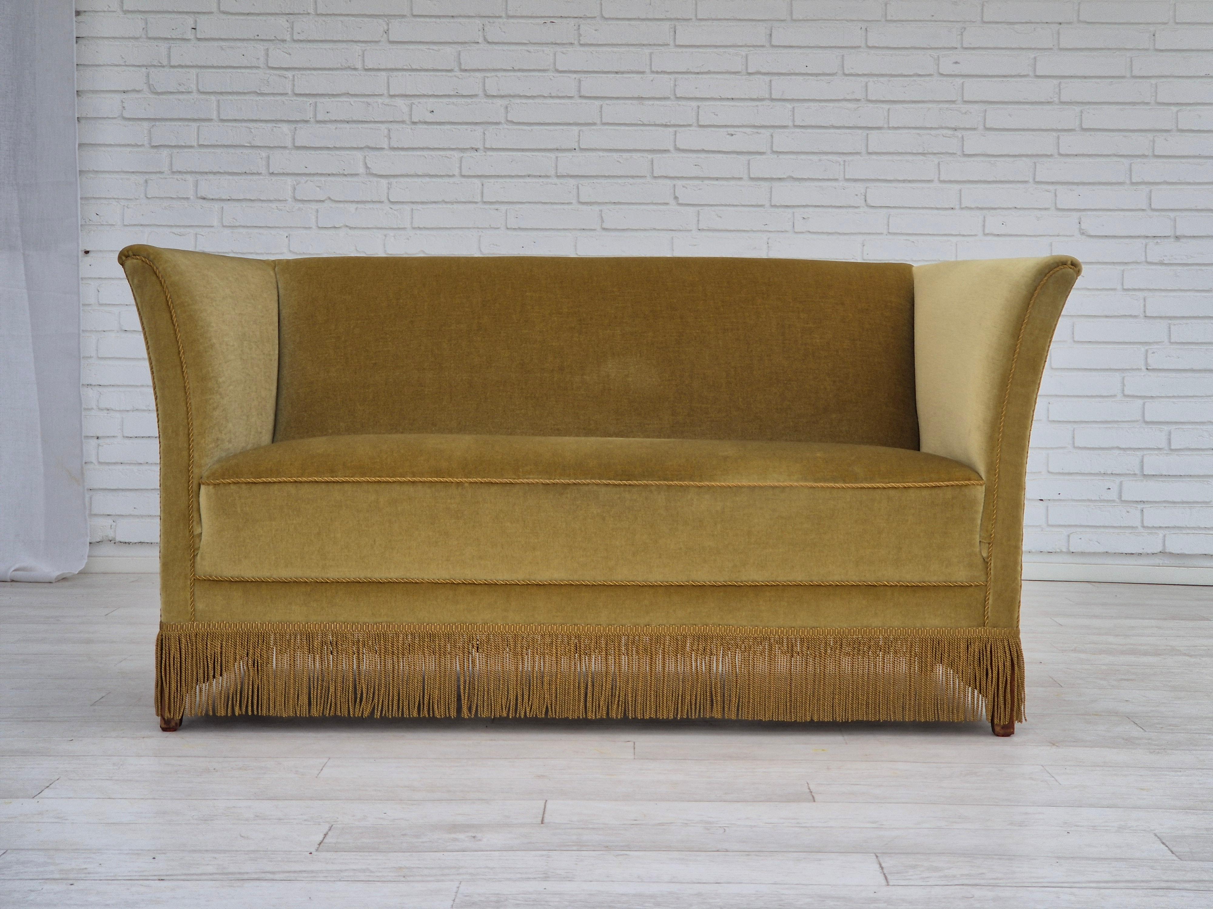 1970s, Danish design, 2 seater sofa in original very good condition: no smells and no stains. Original light green furniture velour, beech wood legs, springs in the seat. Manufactured by Danish furniture manufacturer in about 1970s.