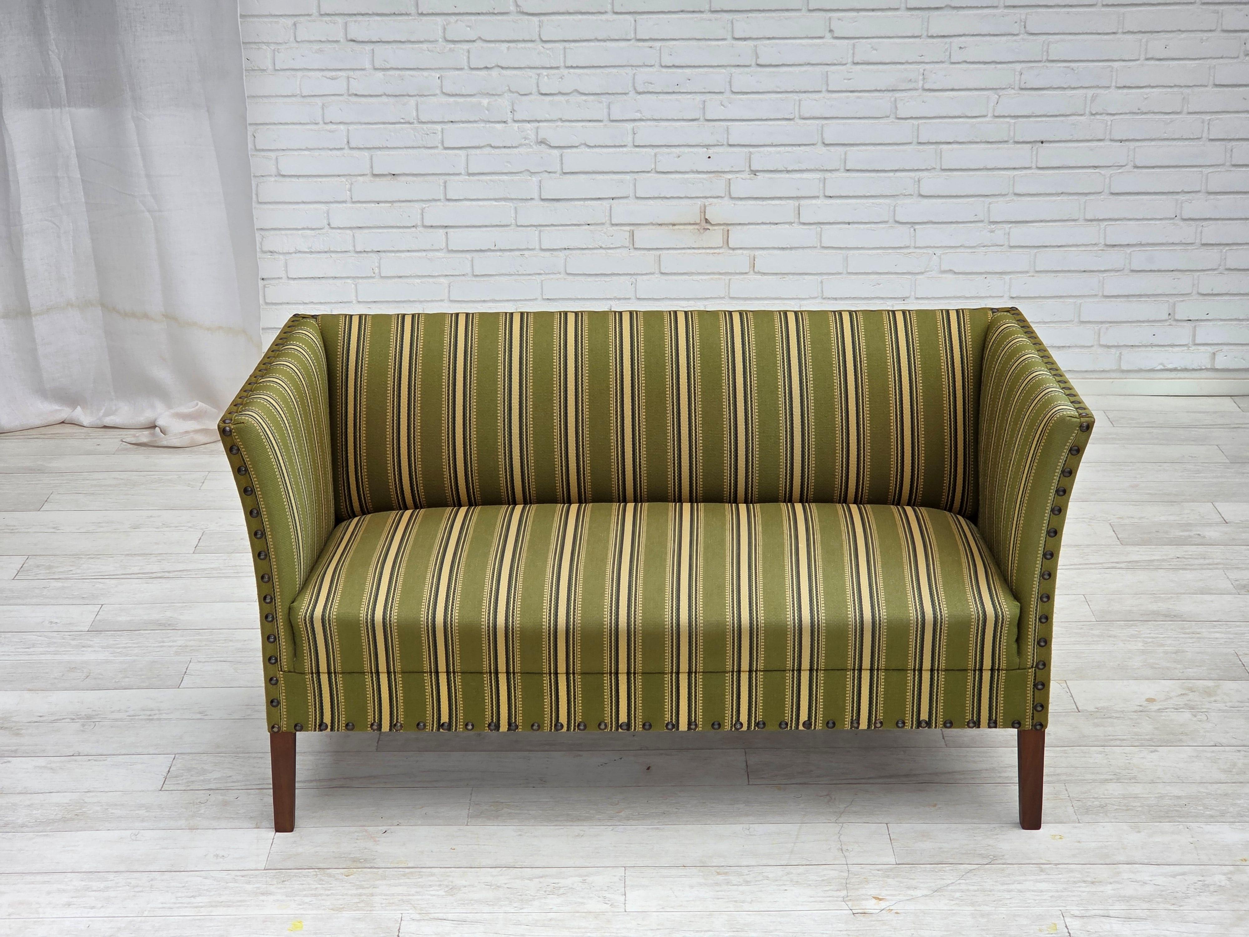 1970s, Danish 2-seater sofa. Original green furniture wool, beech wood legs, springs in the seat. Original good condition: no smells, no stains and stable construction. Manufactured by Danish furniture maker in about 1970-75s. Original Scandinavian