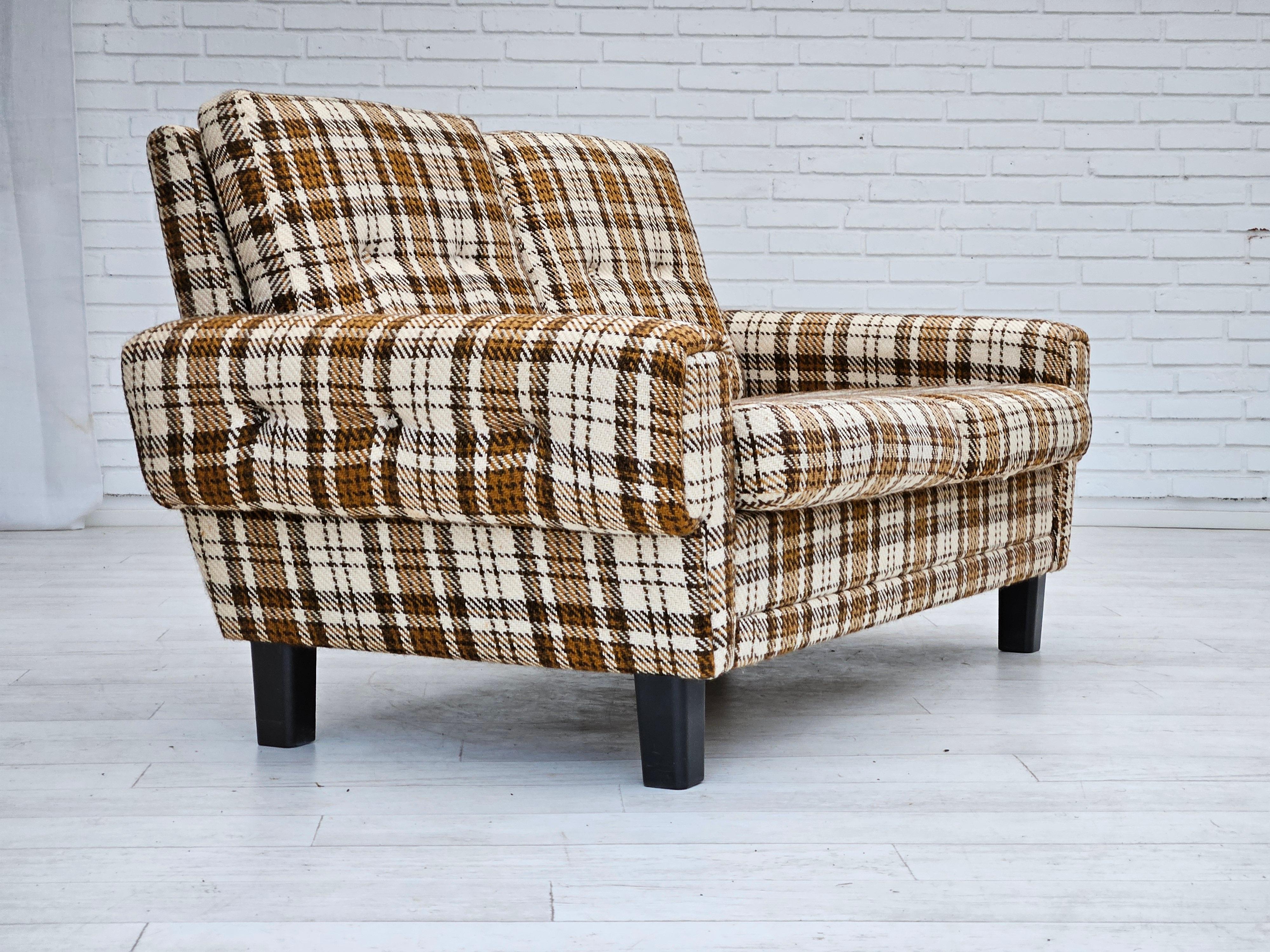 1970s, Danish 2 seater sofa in original very good condition: no smells and no stains. Furniture wool fabric, removable cushions, brown plastic legs. Manufactured by Danish furniture manufacturer in about 1970-75.