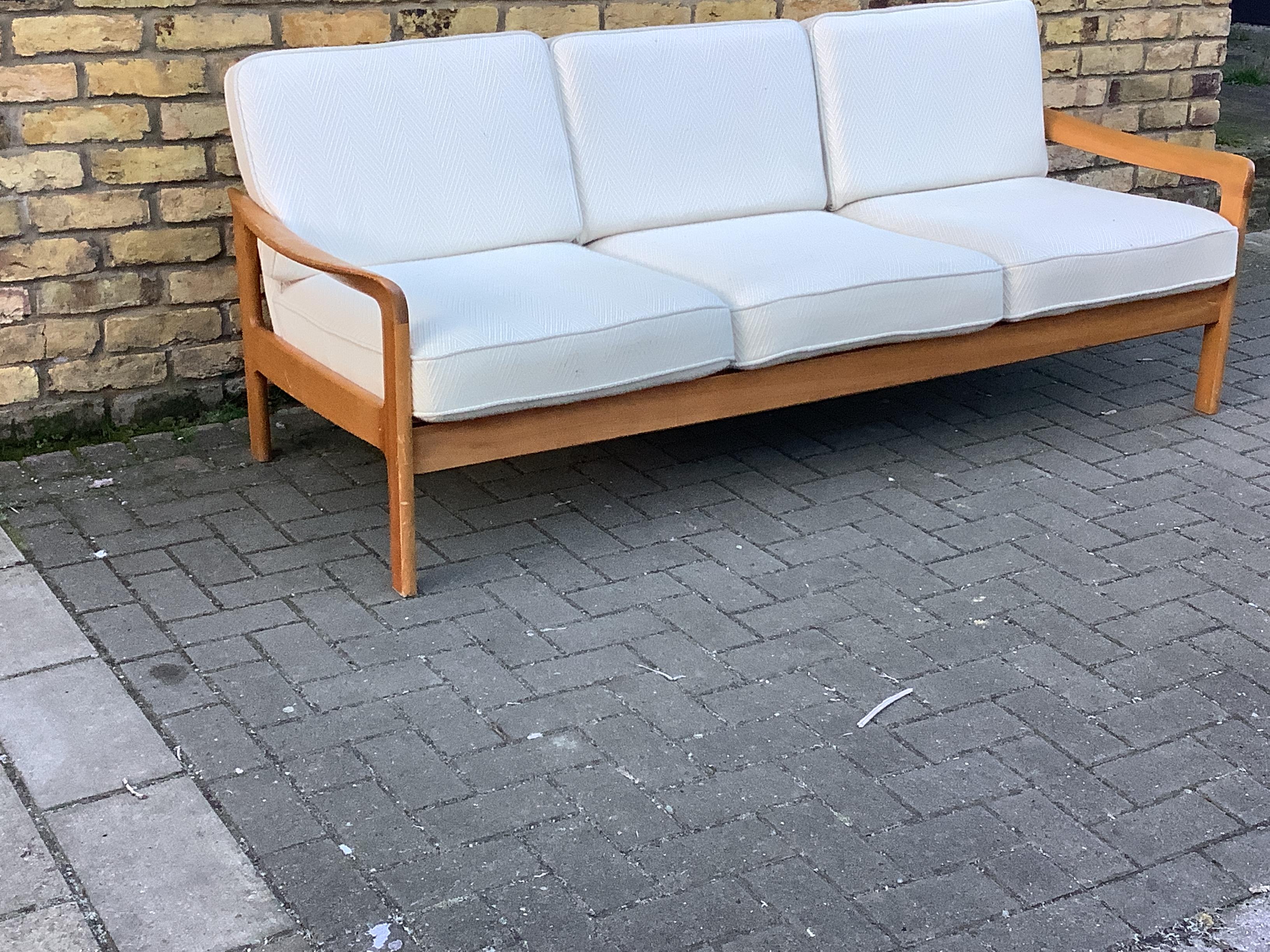 Classic Danish 3 seater sofa with wool upholstery the seats cushions are sprung 
the frame is solid beech wood with a flared arms design super comfortable.
Cc1970s