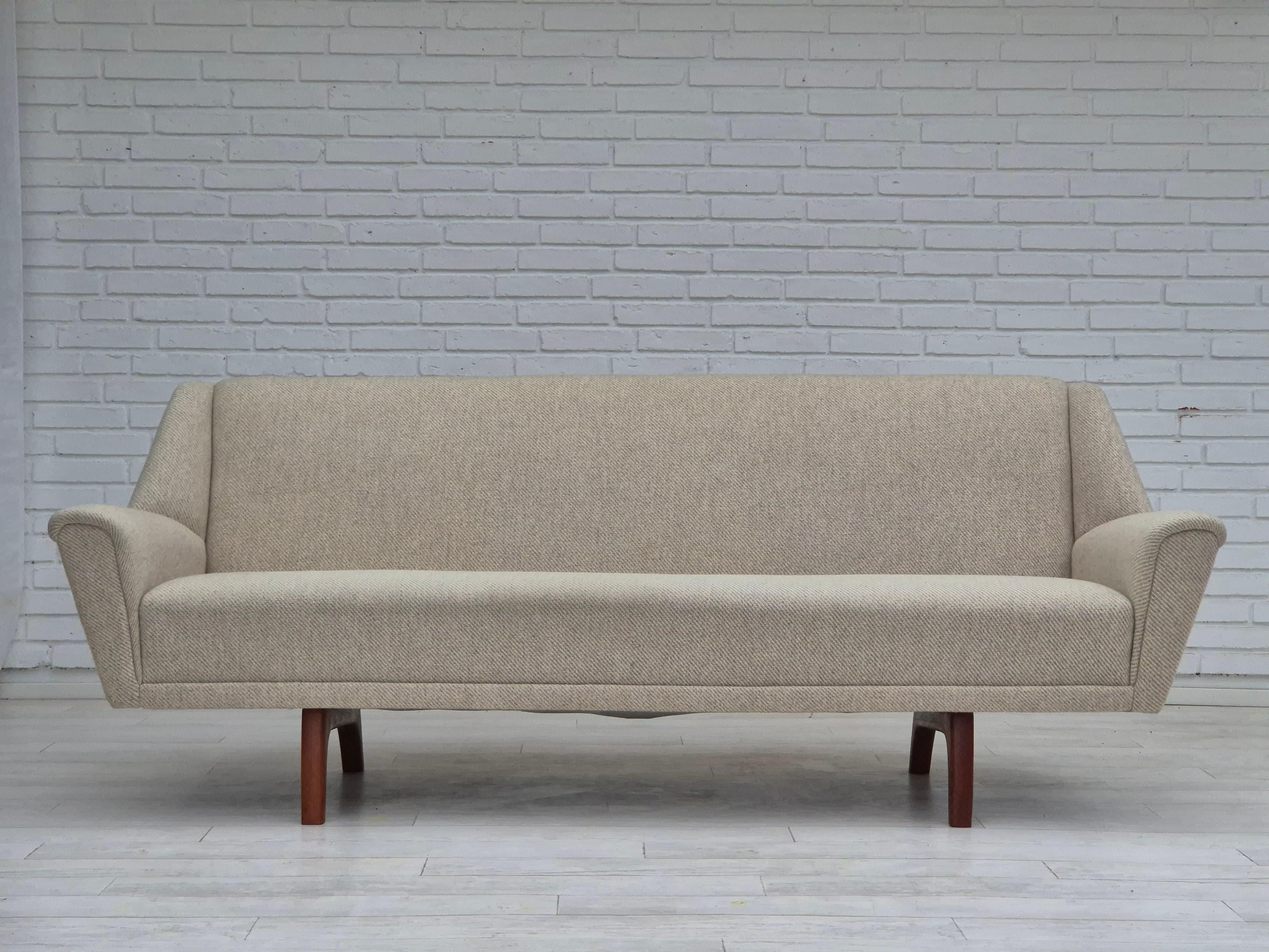 1970s, Danish 3 seater sofa in original very good condition: no smells and no stains. Furniture wool fabric, teak wood legs. Manufactured by Danish furniture manufacturer in about 1970s.