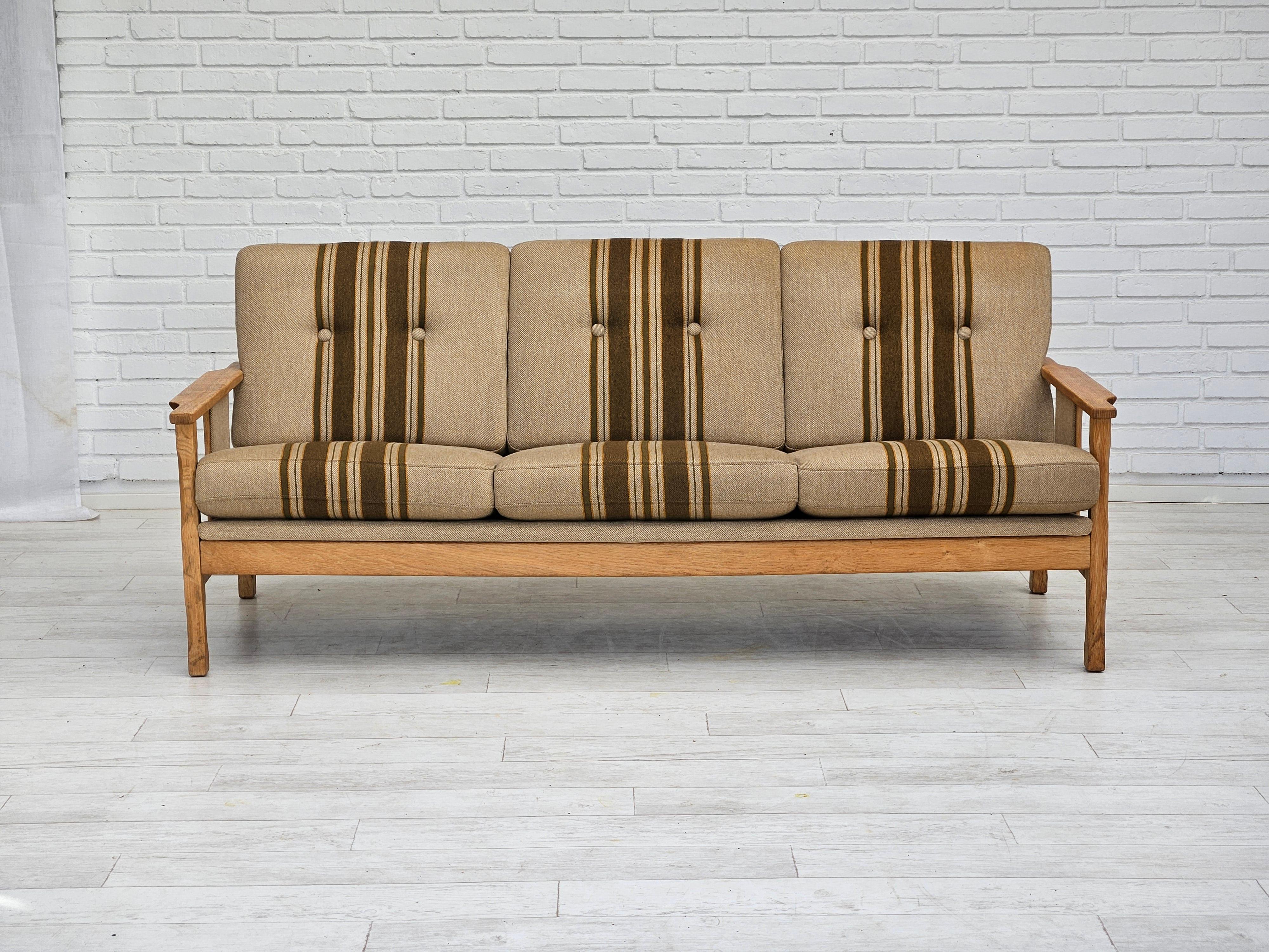 1970s, Danish 3 seater sofa in original very good condition: no smells and no stains. Furniture wool fabric, oak wood. Removable cushions. Manufactured by Danish furniture manufacturer in about 1970s.