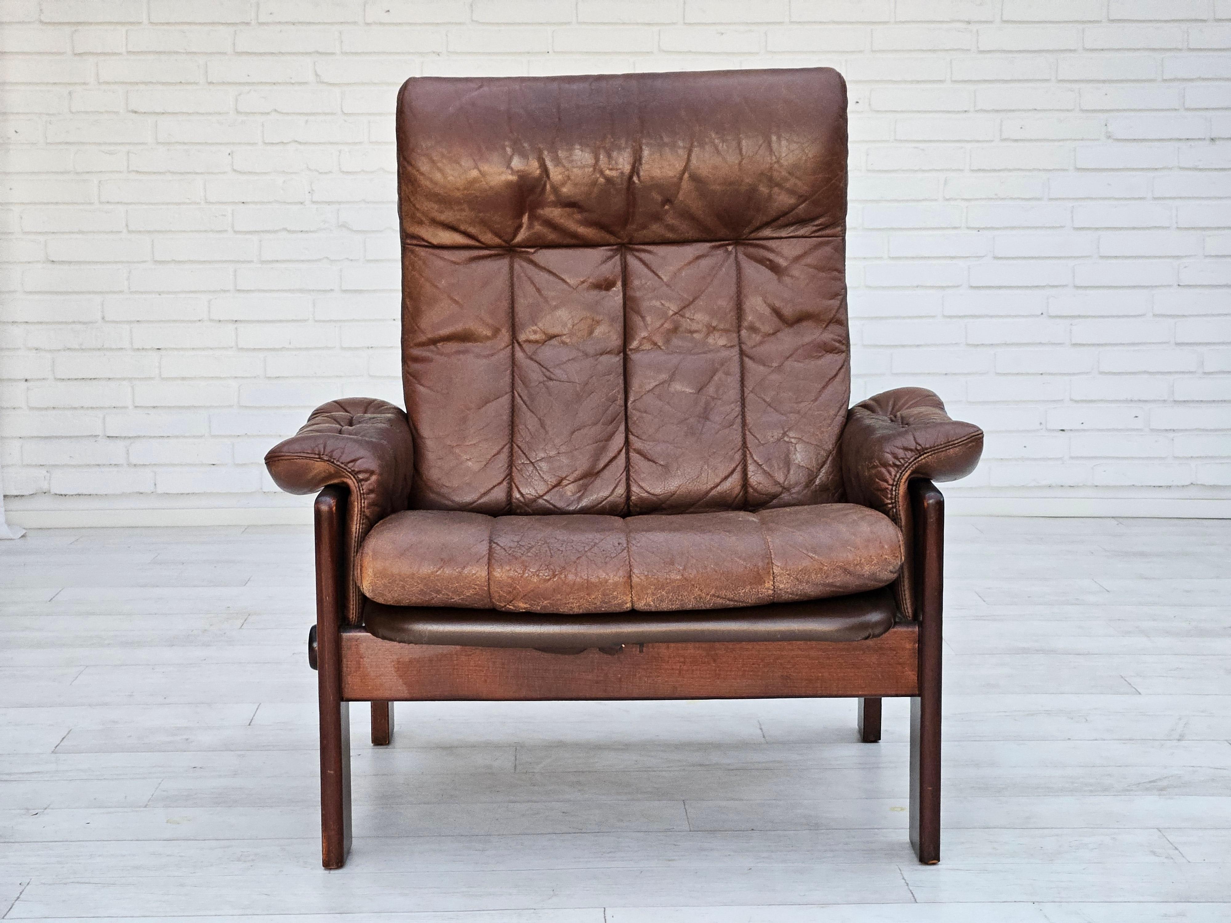 1970s, Danish lounge chair with footstool by Skippers Møbler. Original good condition: no smells and no stains. Brown leather with patina, beech wood. Adjustable seat/back.