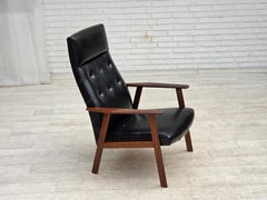 1970s, Danish armchair, black artificial leather, teak wood.