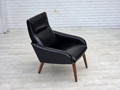 1970s, Danish armchair, black artificial leather, teak wood legs.