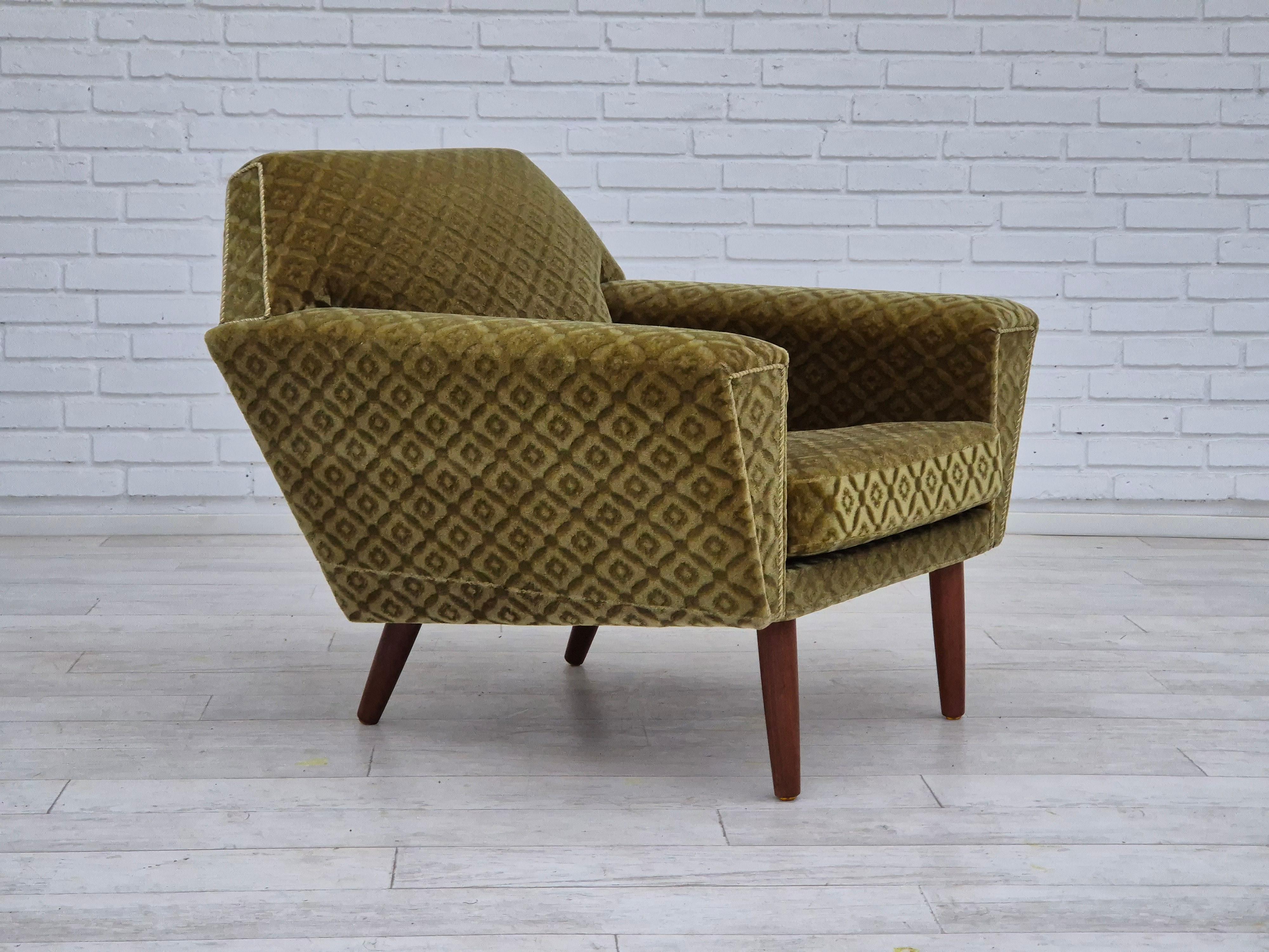 1970s, Danish armchair in original very good condition: no smells and no stains. Green furniture velour, teak wood legs. Springs in the seat cushion. Manufactured by Danish furniture manufacturer in about 1970s. Designed by Georg Thams for Vejen