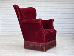 1970s, Danish armchair, cherry-red furniture velour, oak wood legs.