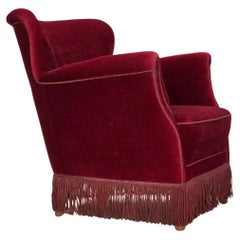 1970s, Danish armchair, cherry-red furniture velour, oak wood legs.