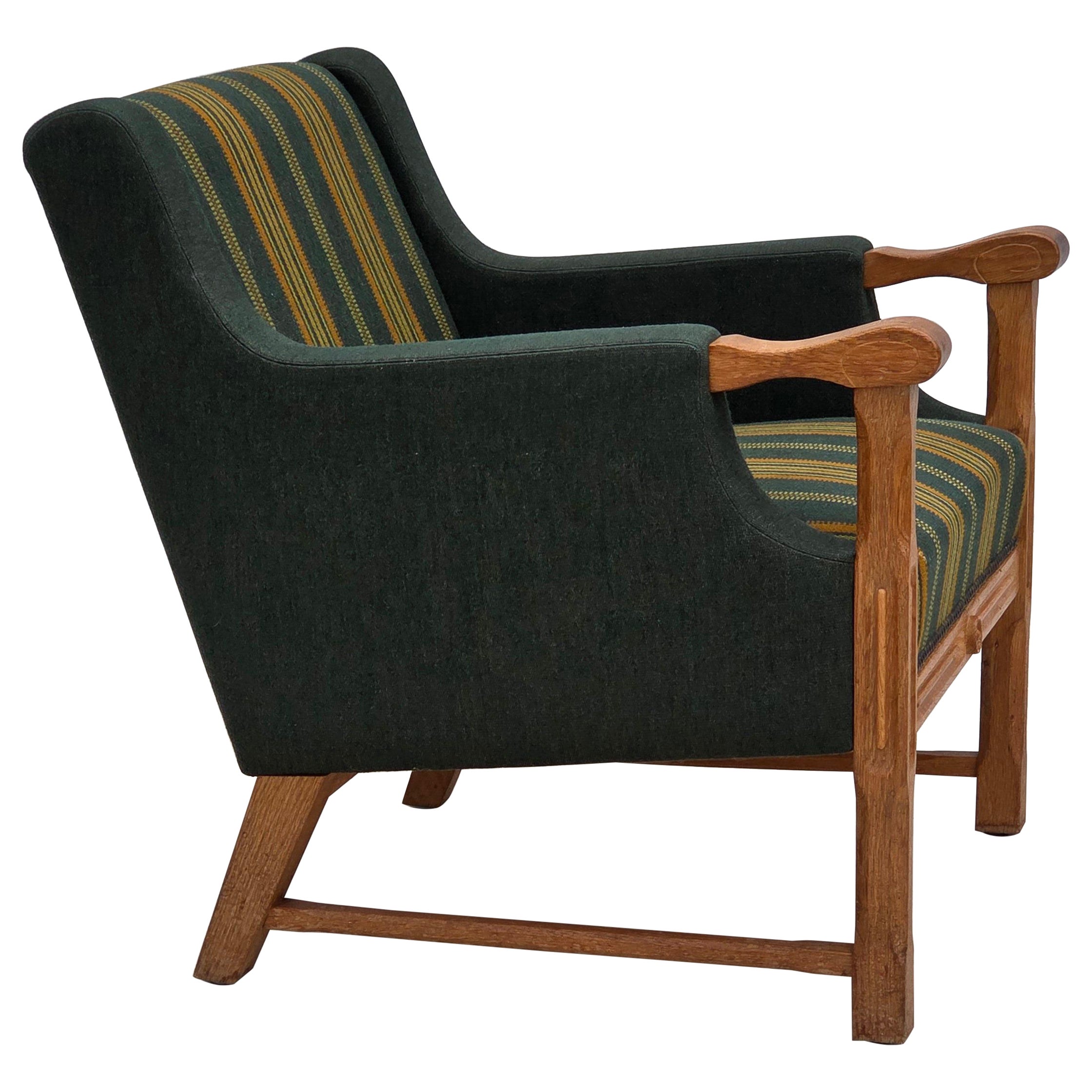 1970s, Danish armchair, green furniture wool, solid oak wood. For Sale