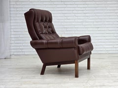 Années 1970, fauteuil danois, cuir d'ameublement marron d'origine.