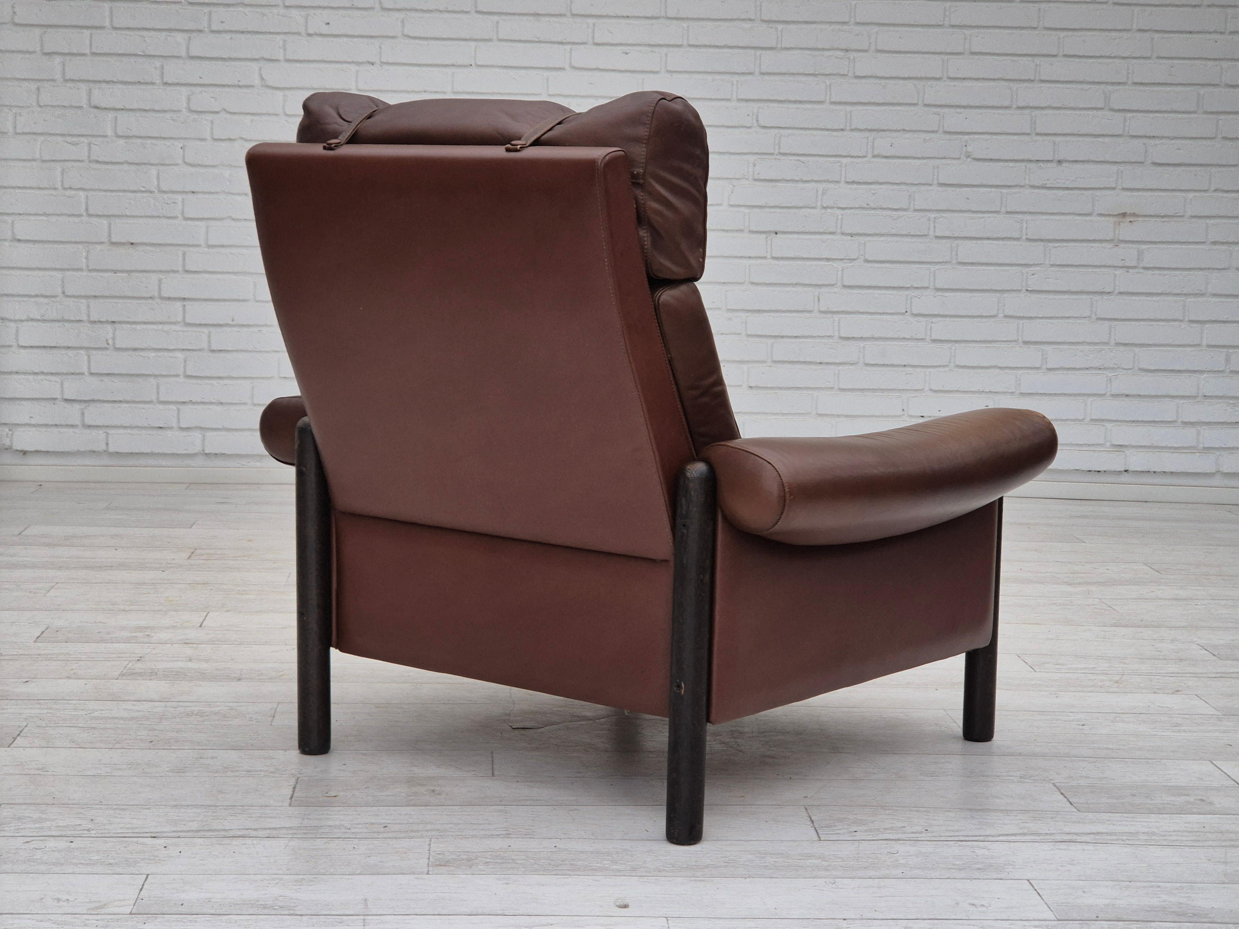 Late 20th Century 1970s, Danish armchair, original condition, furniture leather, dark oak wood. For Sale
