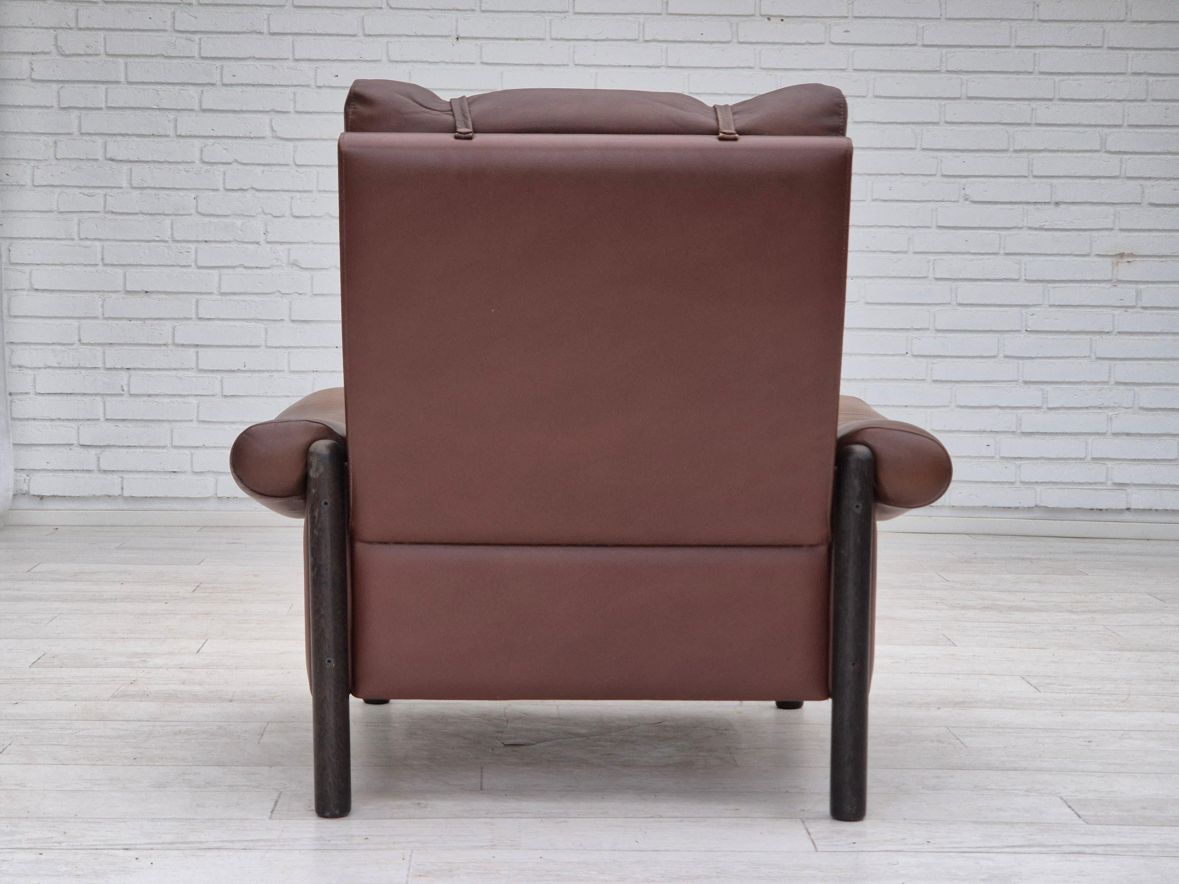 Leather 1970s, Danish armchair, original condition, furniture leather, dark oak wood. For Sale
