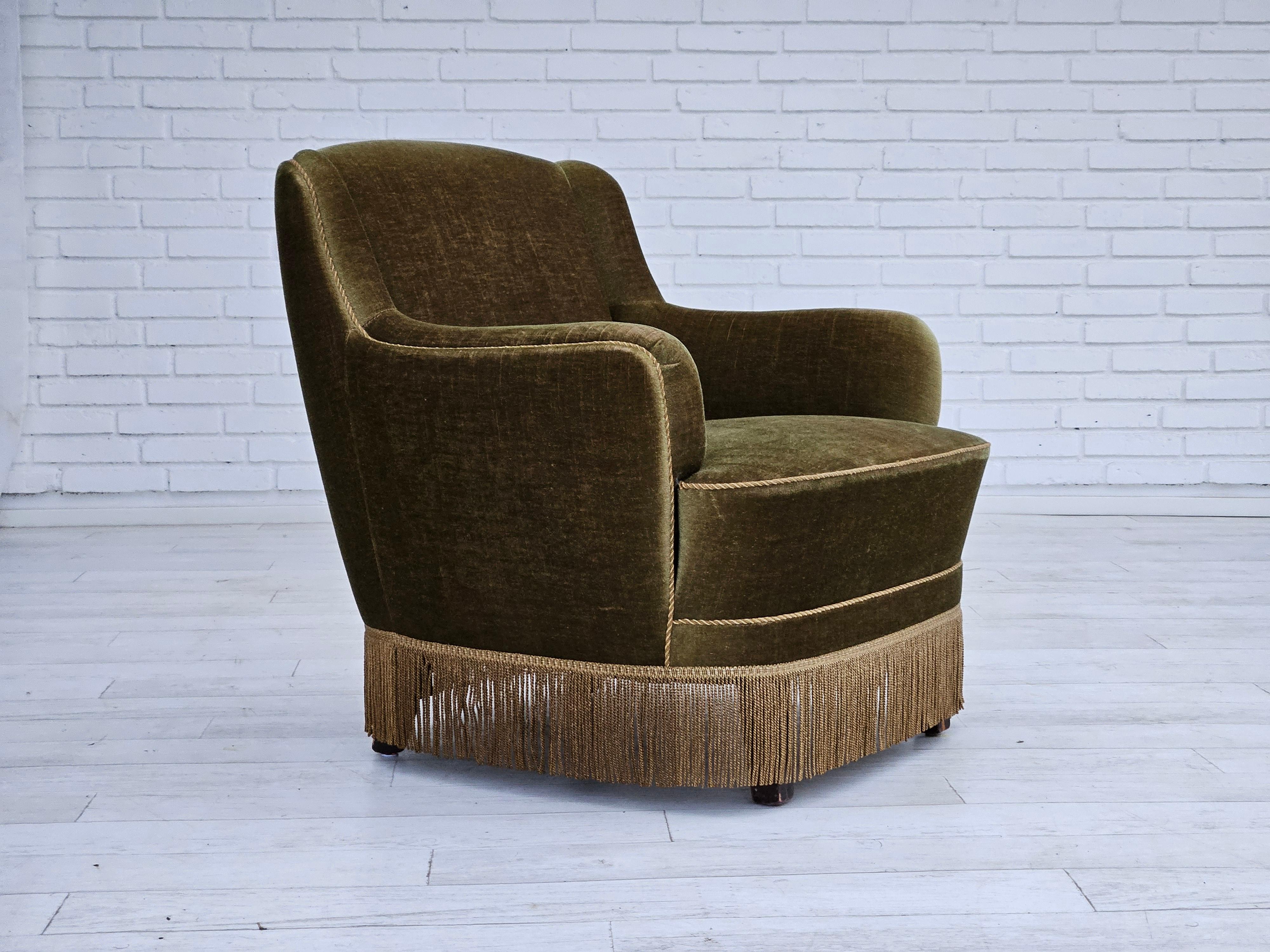 1970s, Danish lounge chair in original very good condition: no smells and no stains. Original olive green furniture velour. Beech wood legs, springs in the seat. Manufactured by Danish furniture manufacturer in about 1970s.