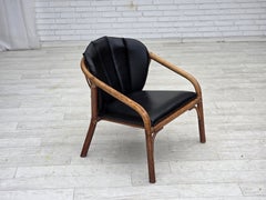 1970s, Danish armchair, rattan, black artificial leather.