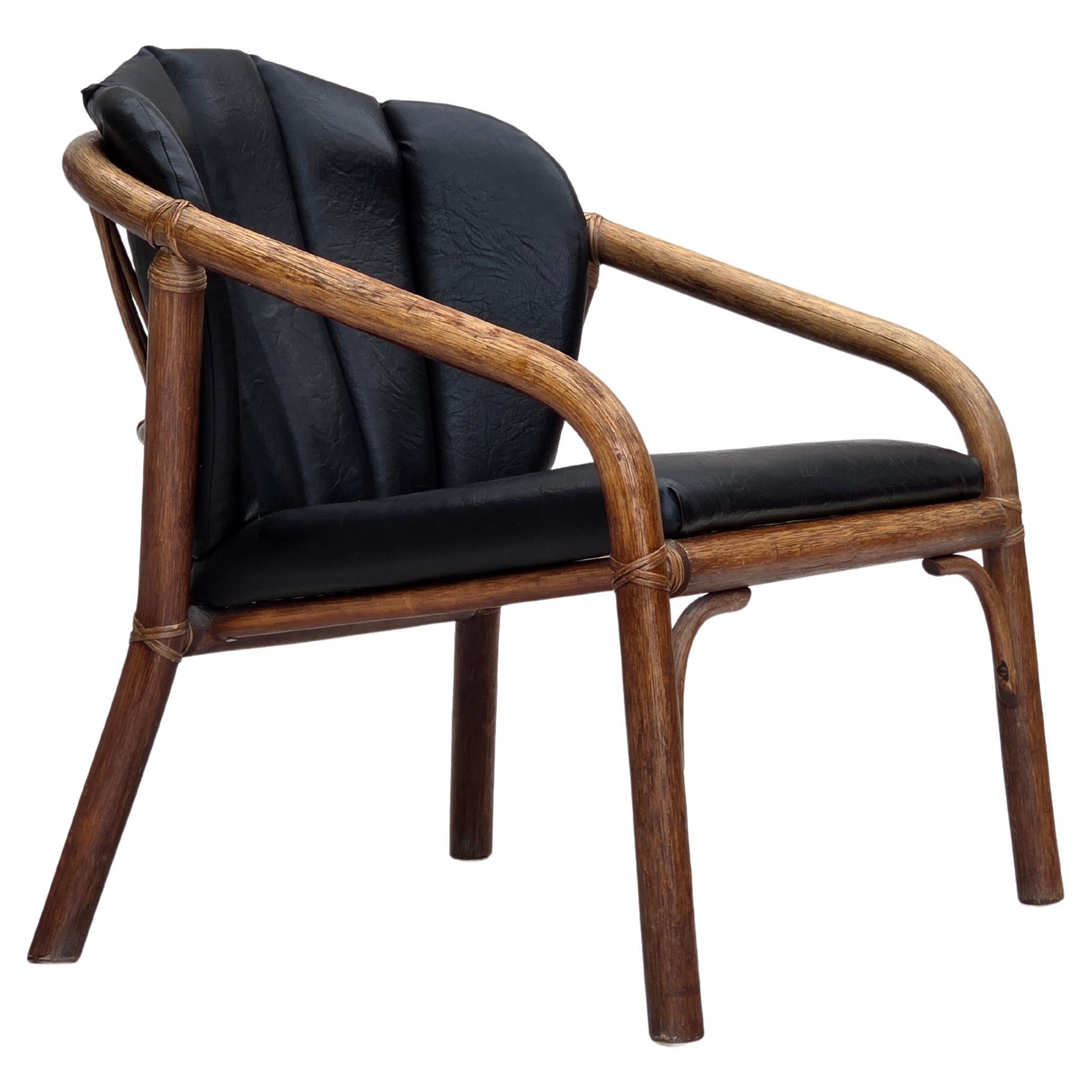 1970s, Danish armchair, rattan, black artificial leather. For Sale