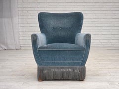 1970s, Danish armchair with footstool, blue furniture velour, oak wood legs.