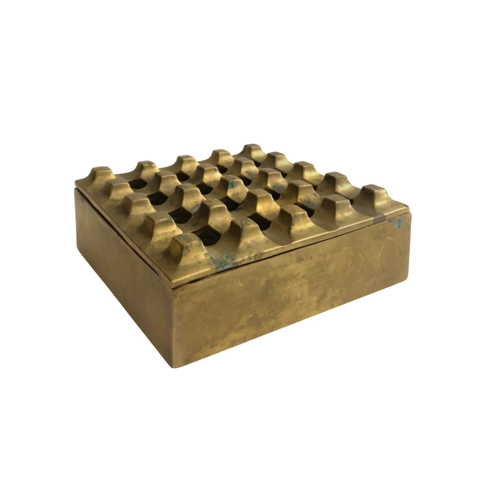 Brass grid ashtray in the manner of an Ultima 15 model by Holger Bäckström & Bo Ljungberg. Denmark, 1960's.