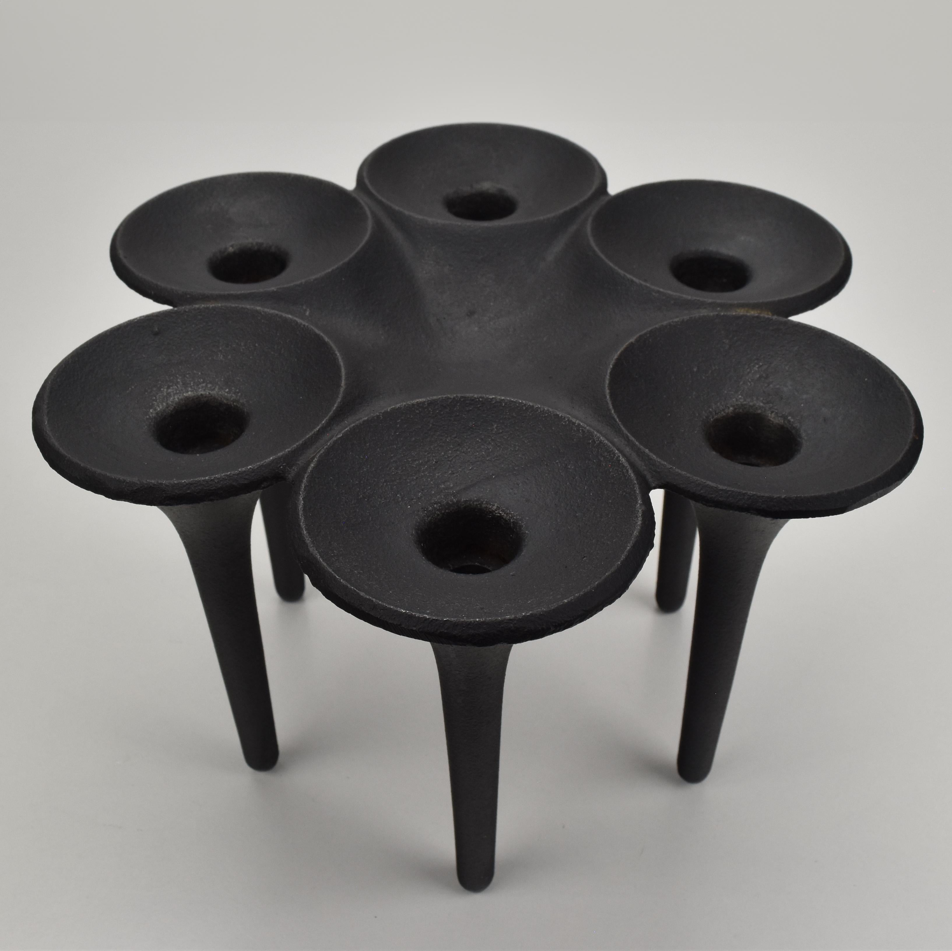 A vintage mid century modern black patinated cast iron 