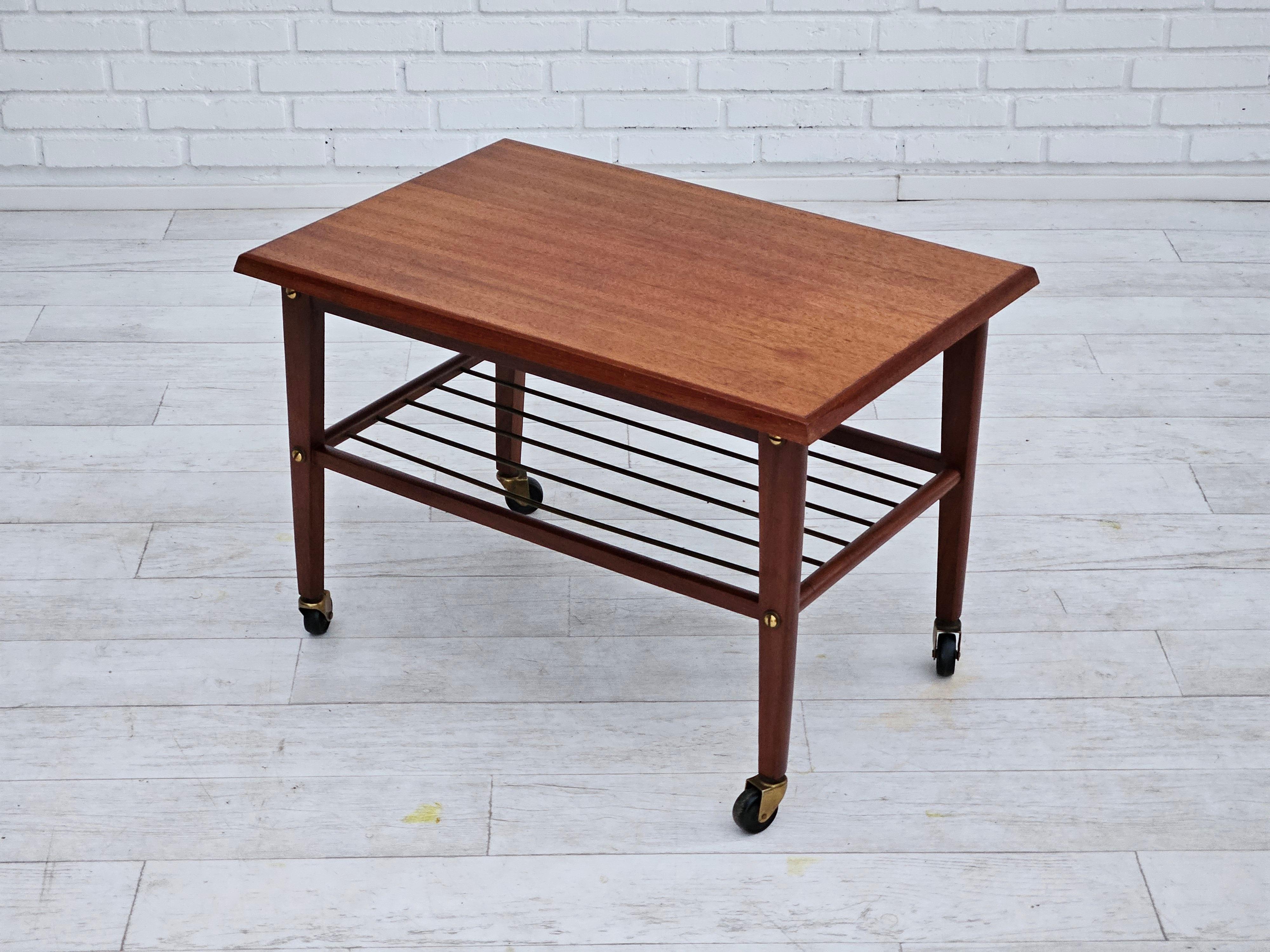 Brass 1970s, Danish coffee table, wheels, teak wood. For Sale