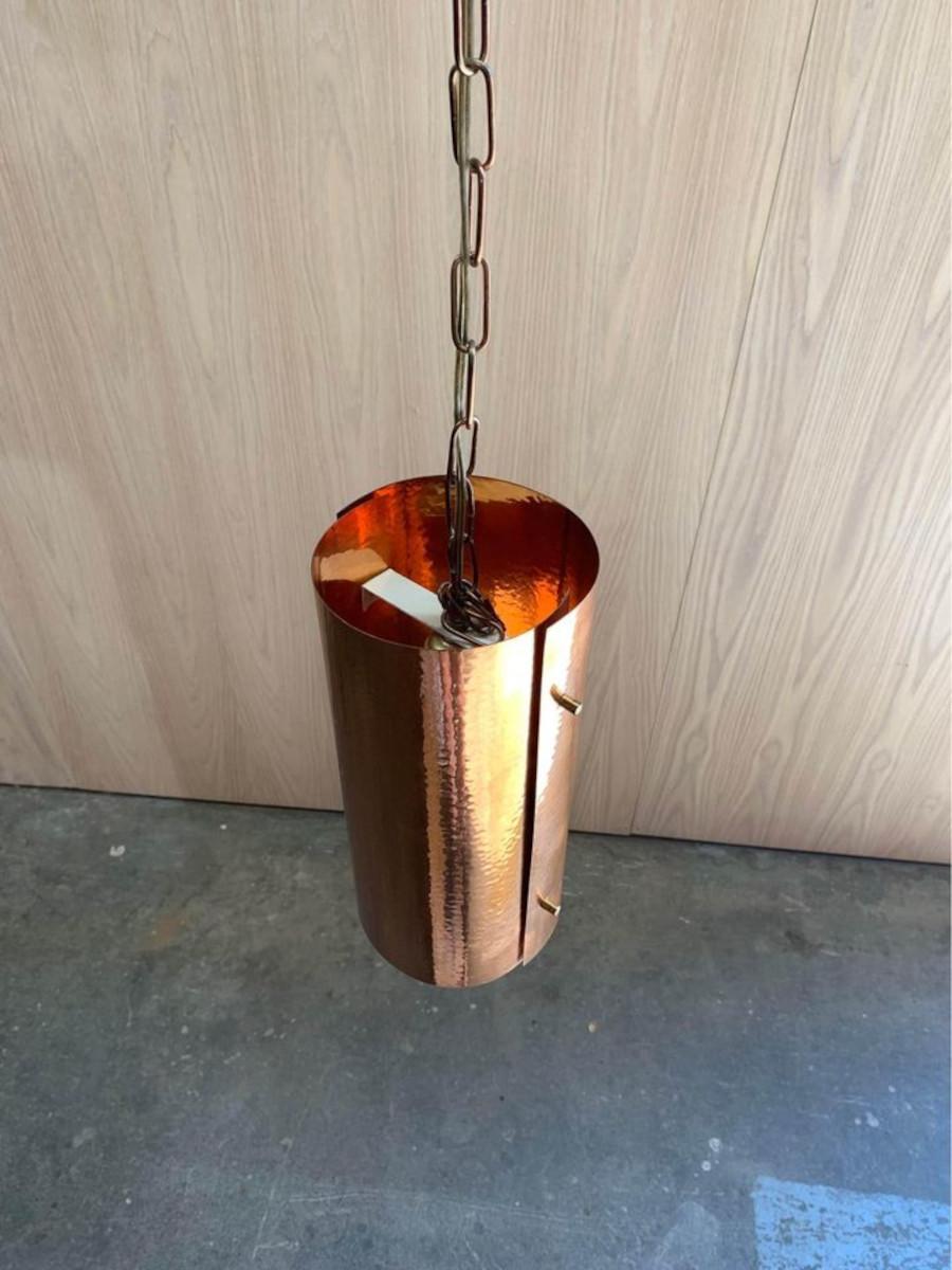 Maintained in exceptional condition throughout its lifetime, this simple light was constructed from a sheet of copper in Denmark during the 1970s. We purchased this piece from the original owner, who also provided us with the original bag it was