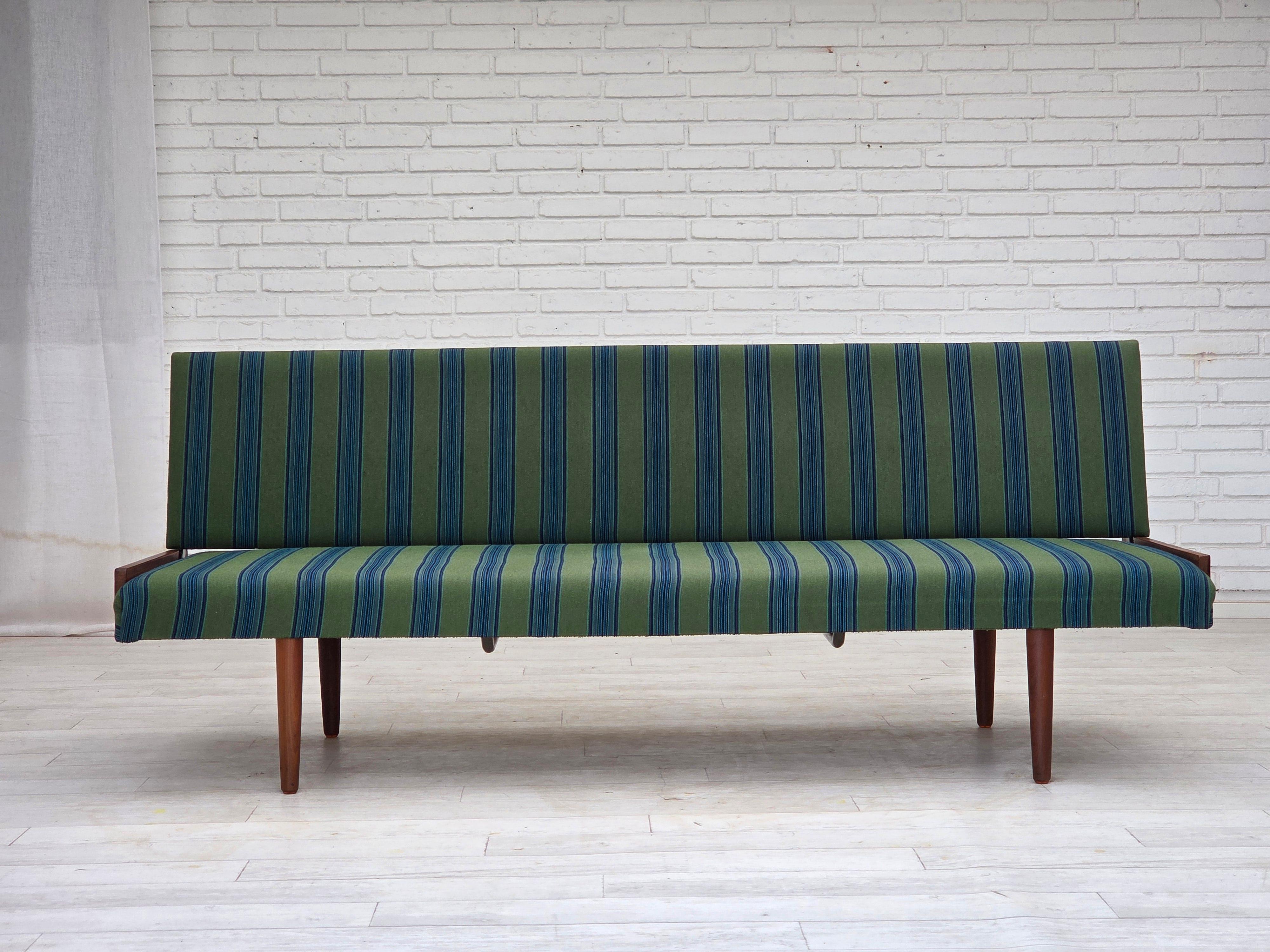 1970s, Danish daybed. Original quality furniture wool, solid teak wood legs and sides. Original very good conditions: no smells, no stains and stable construction. Manufactured by Danish furniture maker in about 1970s. Original Scandinavian vintage