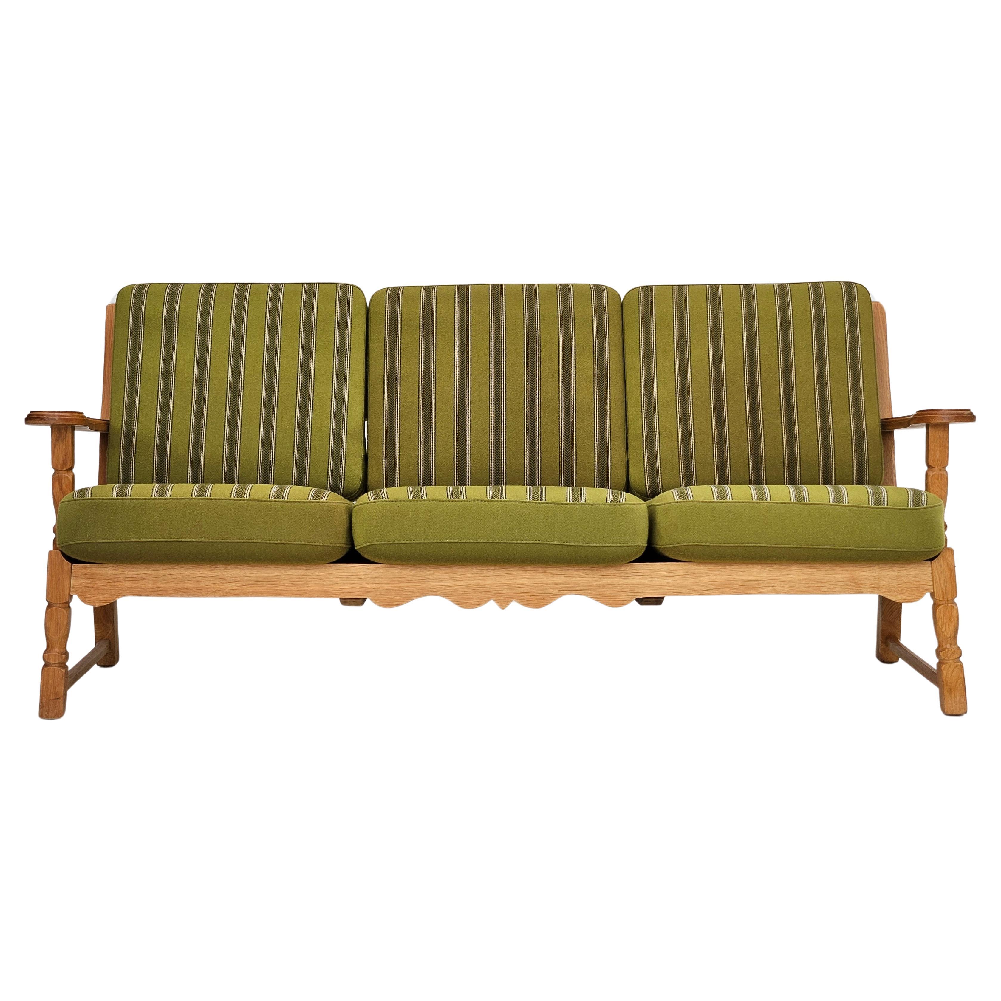 1970s, Danish design, 3 seater sofa in original very good condition: no smells and no stains. Lightly laquiered solid oak wood, furniture wool fabric. Springs in the back and seat cushions. Manufactured by Danish furniture manufacturer in about