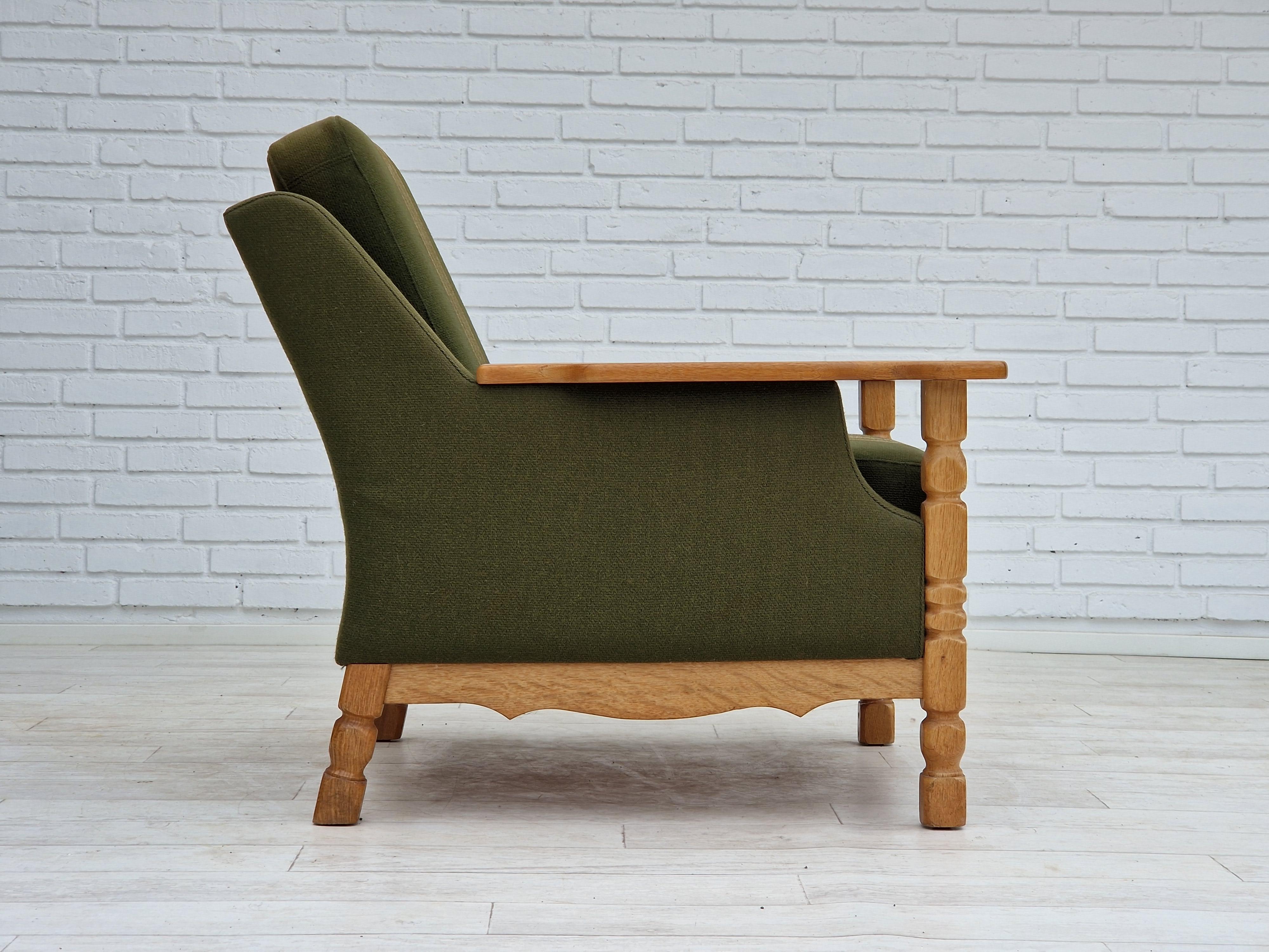 Late 20th Century 1970s, Danish design, lounge chair in green furniture wool, oak wood. For Sale