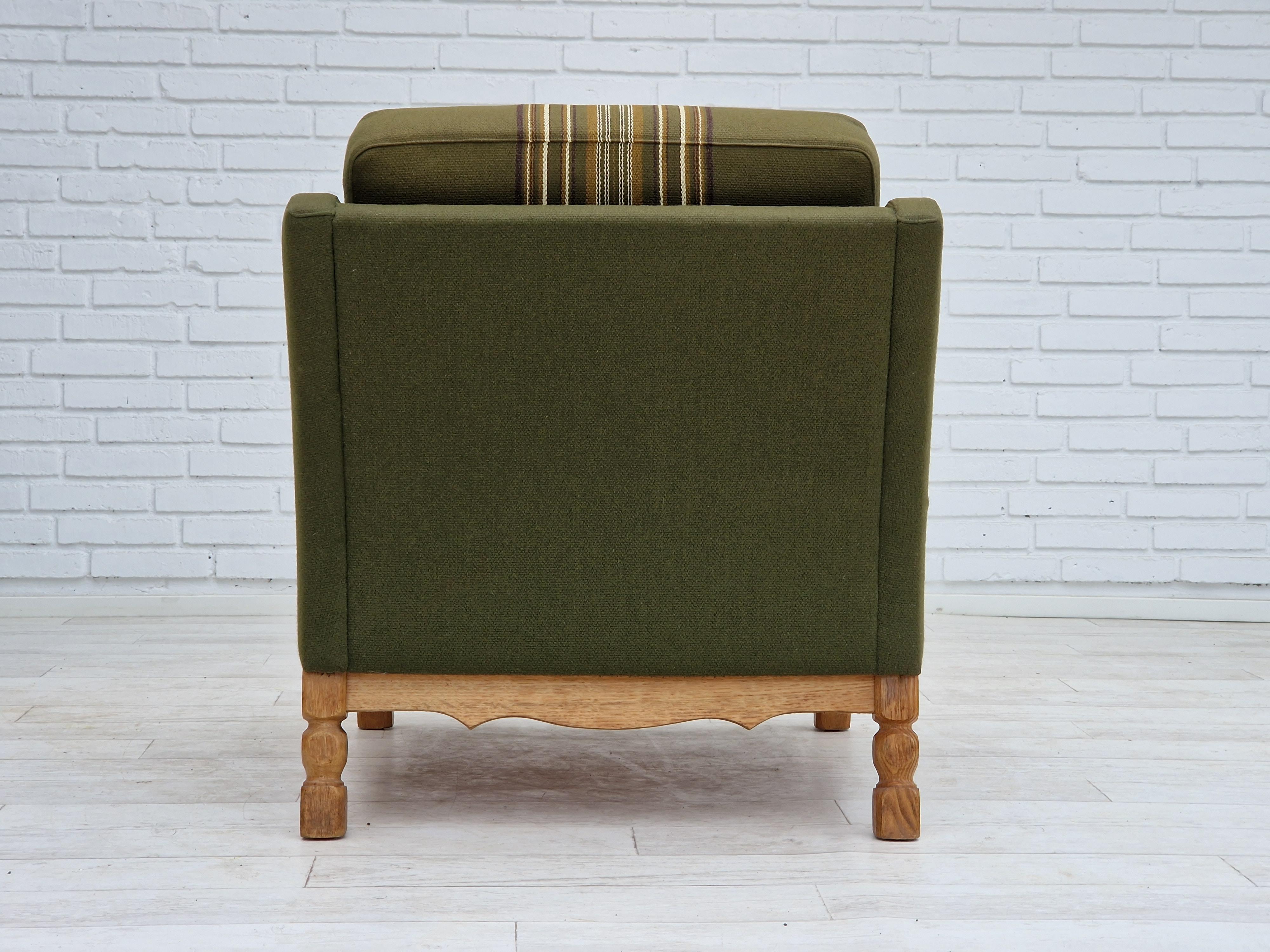 Wool 1970s, Danish design, lounge chair in green furniture wool, oak wood. For Sale