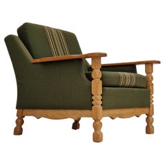 Vintage 1970s, Danish design, lounge chair in green furniture wool, oak wood.