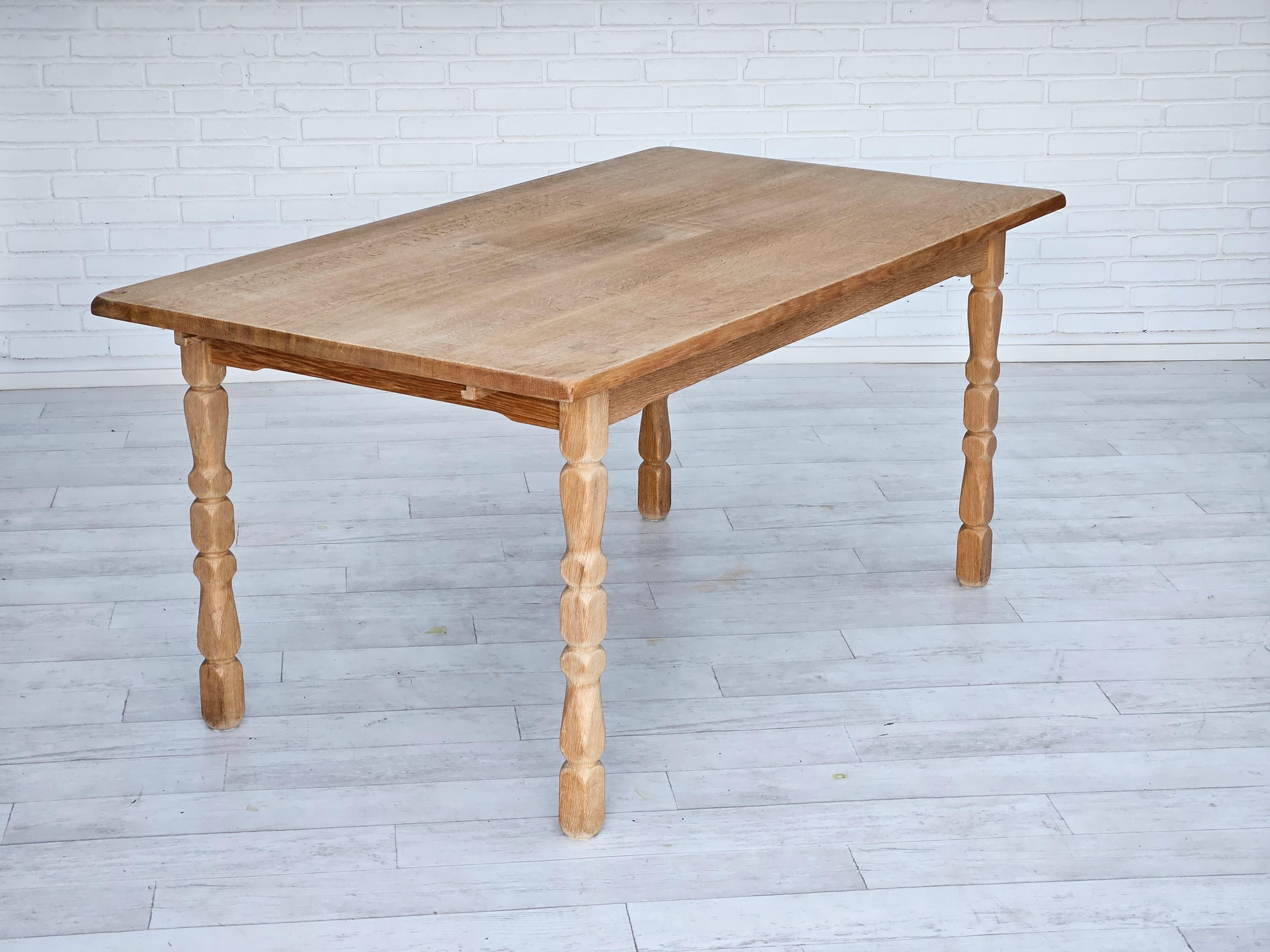 1970s, Danish oak wood dining table in rectangle shape. Solid oak wood. Original very good condition. Removable legs, 2 additional table plates. Manufactured by Danish furniture manufacturer in about 1970s.