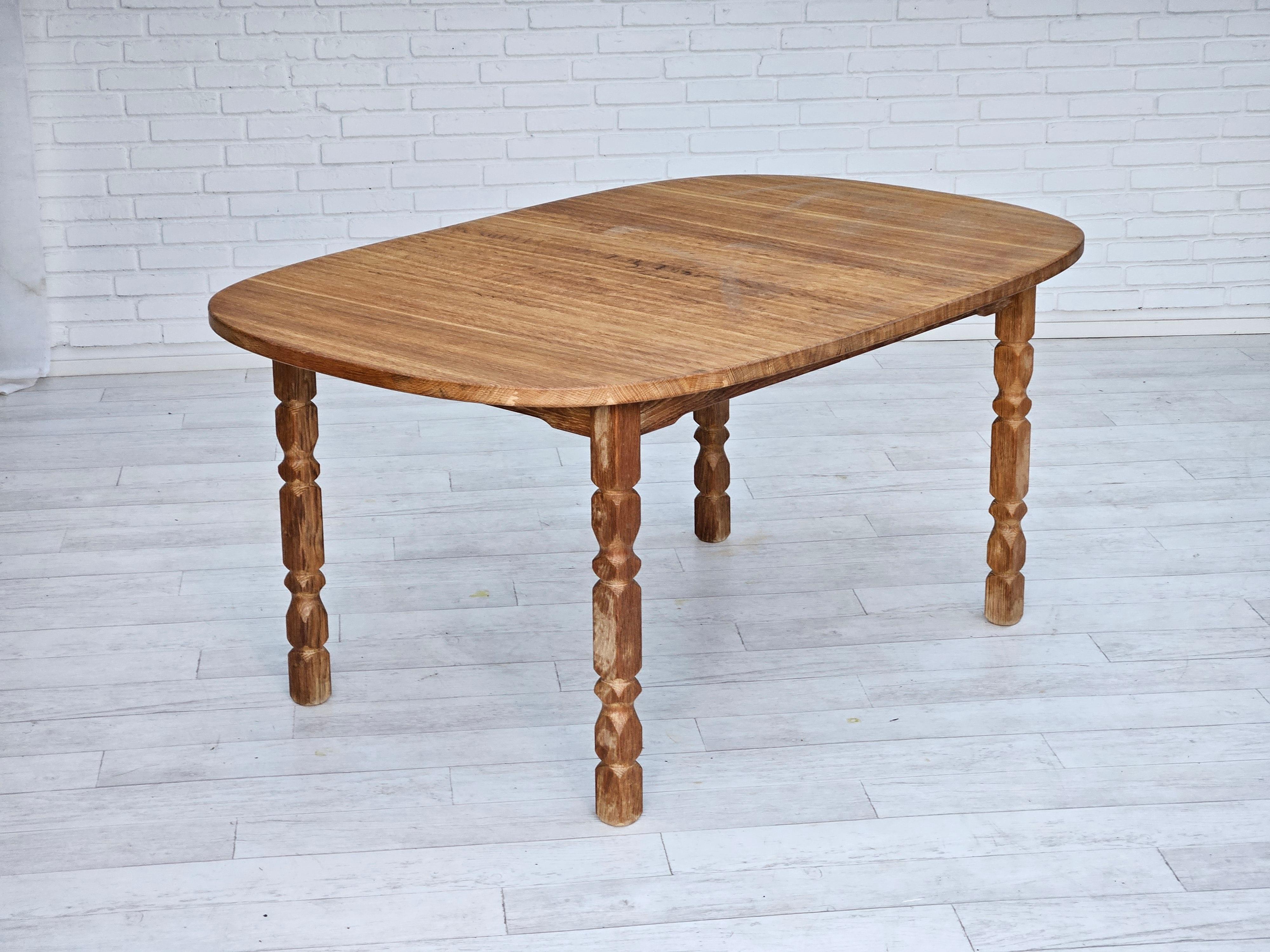 1970s, Danish oak wood dining table in oval shape. Solid oak wood. Original very good condition. Removable legs. Manufactured by Danish furniture manufacturer in about 1970s.