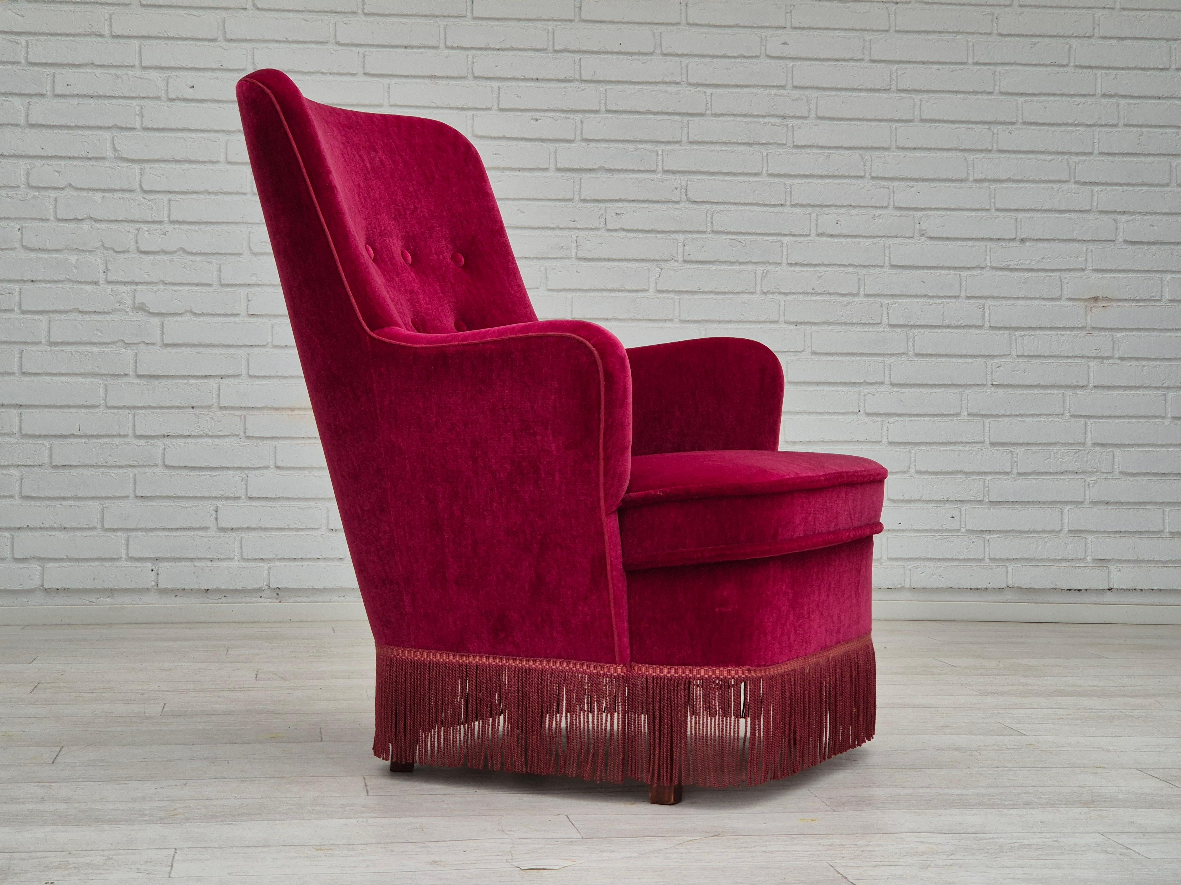 1970s, Danish easy chair in original very good condition: no smells, no stains, stable construction. Original dark red furniture velour, beech wood legs, springs in the seat. Manufactured by Danish furniture maker in about 1970s. The chair was