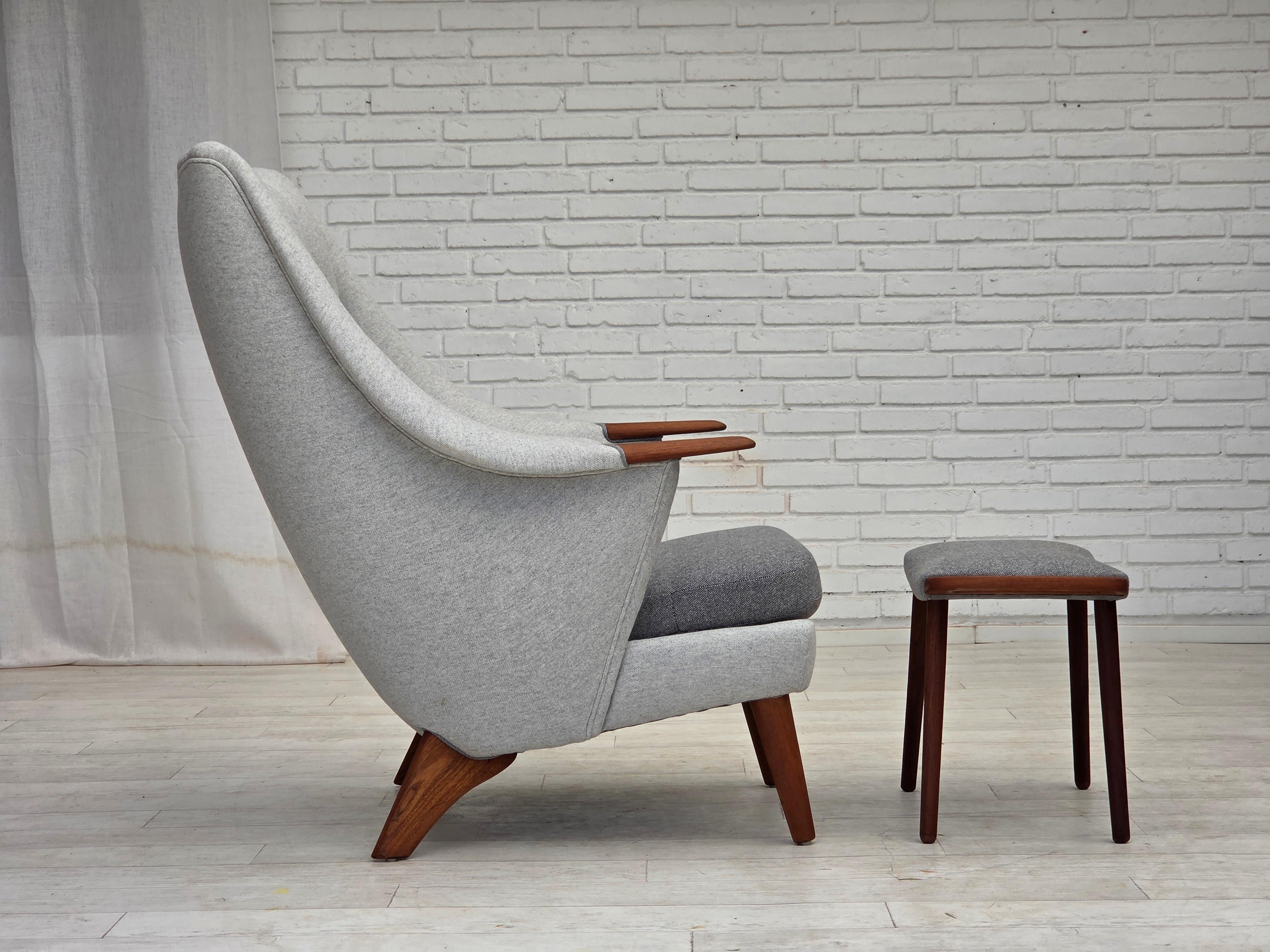 1970s, Danish high-backed armchair with ottoman. Completely renovated-reupholstered in quality grey furniture wool, teak legs and nails, springs in seat cushion. Partially new upholstery. Renovated according to original design. Manufactured by