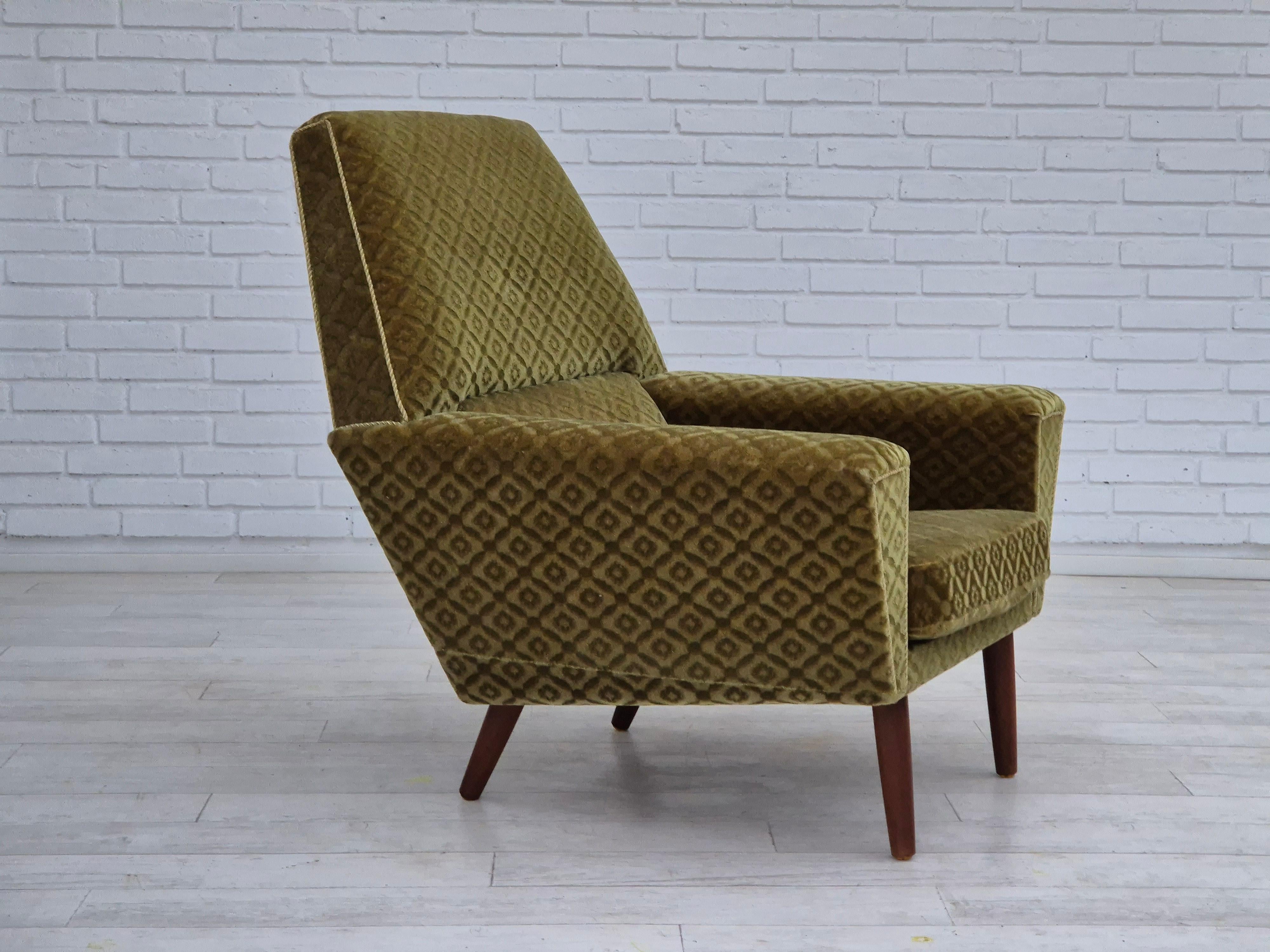 1970s, Danish highback armchair in original very good condition: no smells and no stains. Green furniture velour, teak wood legs. Springs in the seat cushion. Manufactured by Danish furniture manufacturer in about 1970s. Designed by Georg Thams for