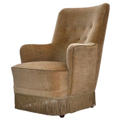 1970, fauteuil danois à dossier haut, velours d'ameublement vert clair.