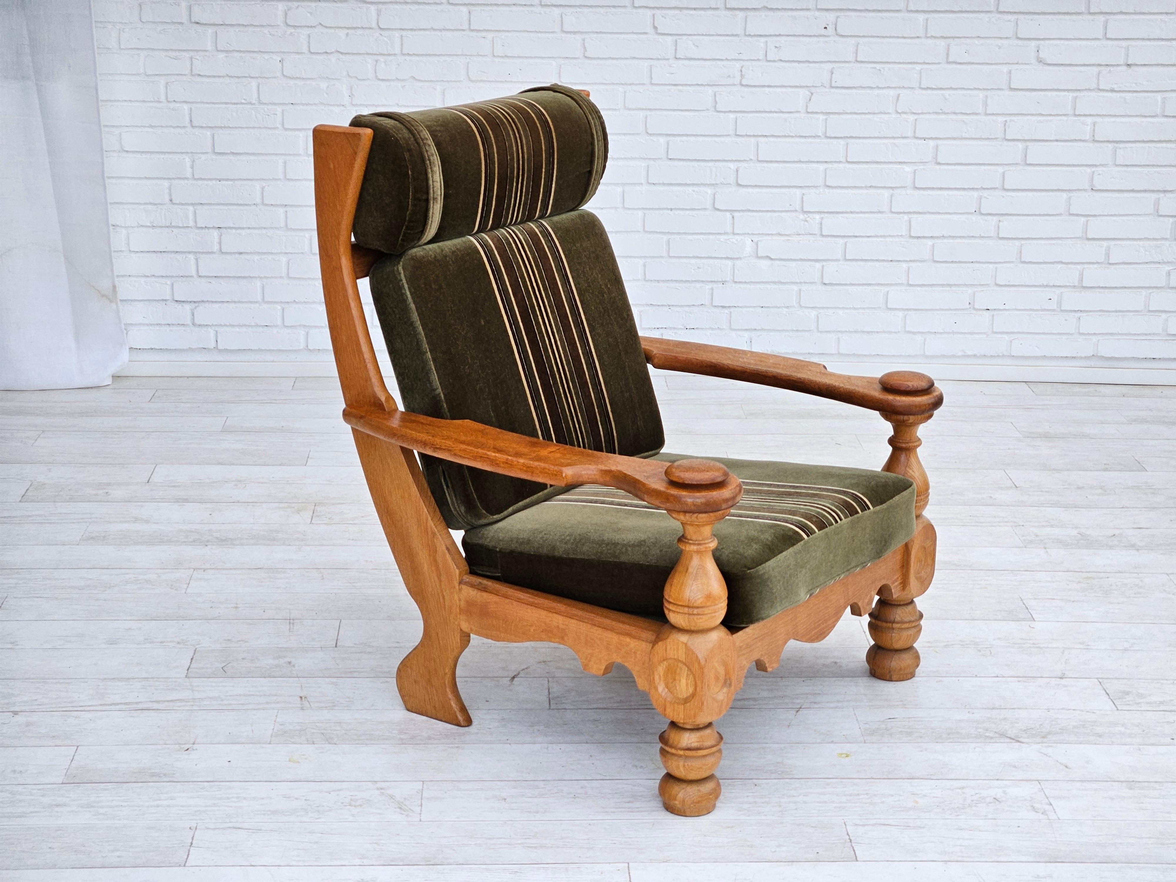 1970s, Danish highback armchair in original very good condition: no smells and no stains. Solid oak wood, furniture green velour. Removable cushions. Manufactured by Danish furniture manufacturer in about 1970s.