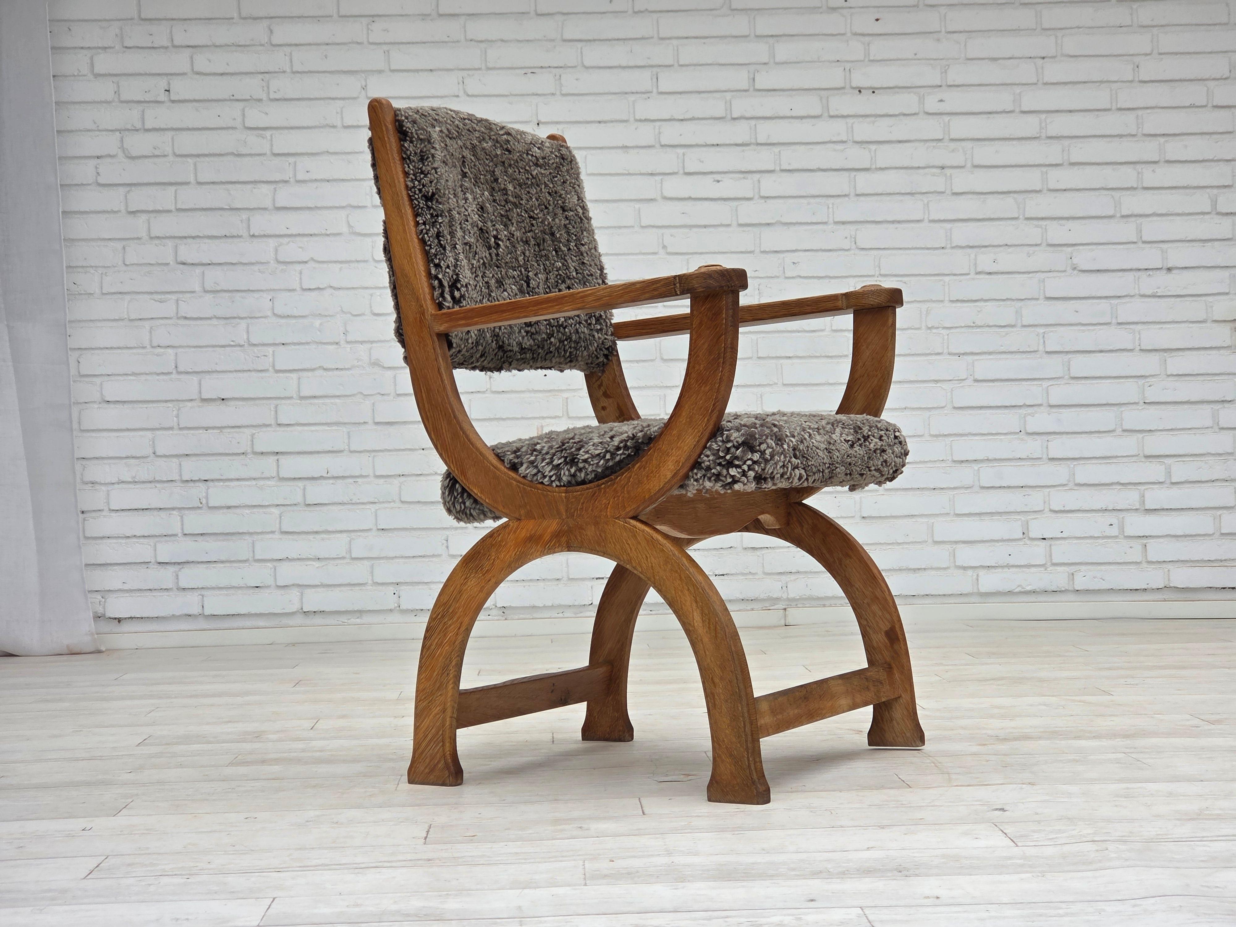 1970s, Danish lounge chair. Reupholstered by craftsman in quality New Zealand genuine sheepskin 